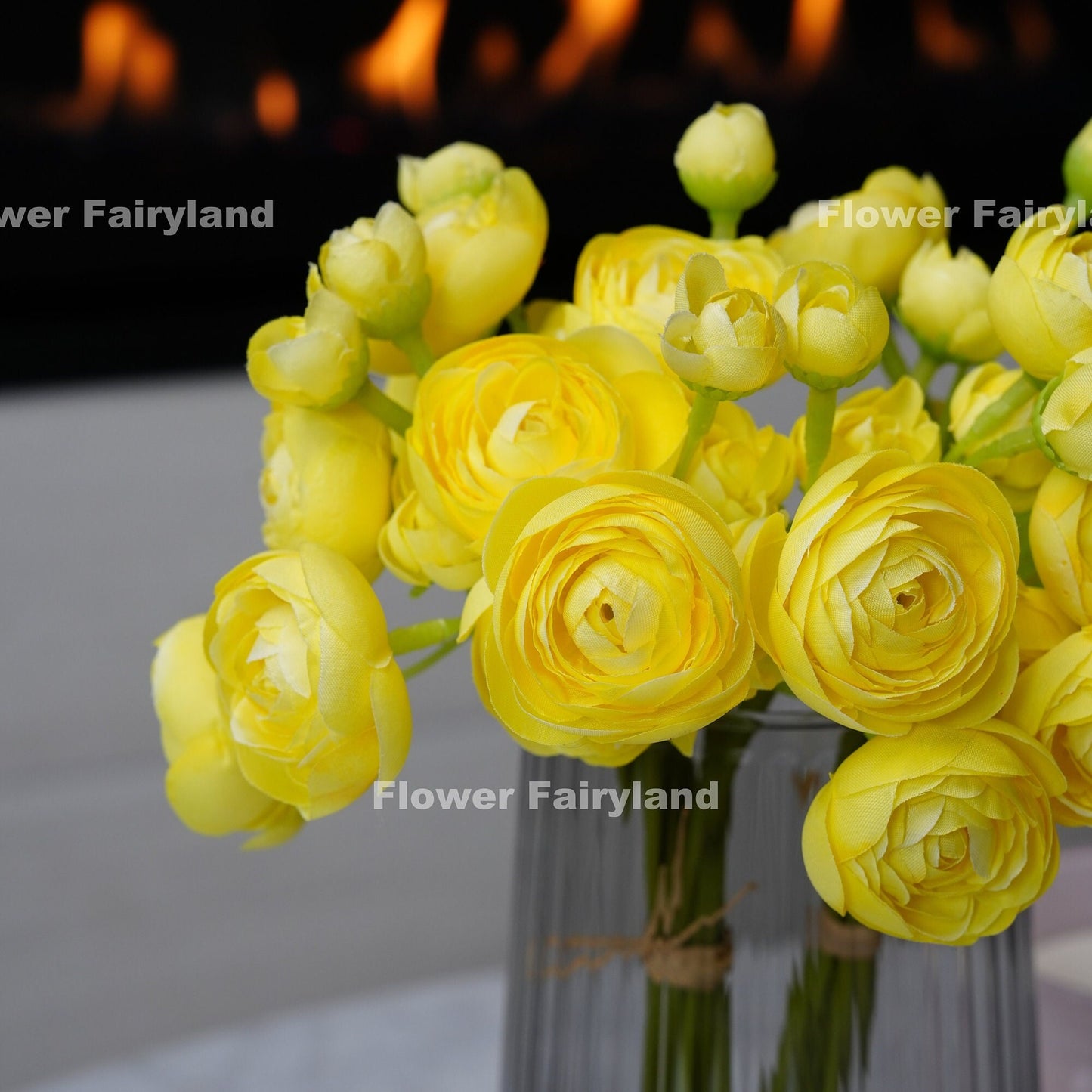 Yellow ranunculus bundle held in hand