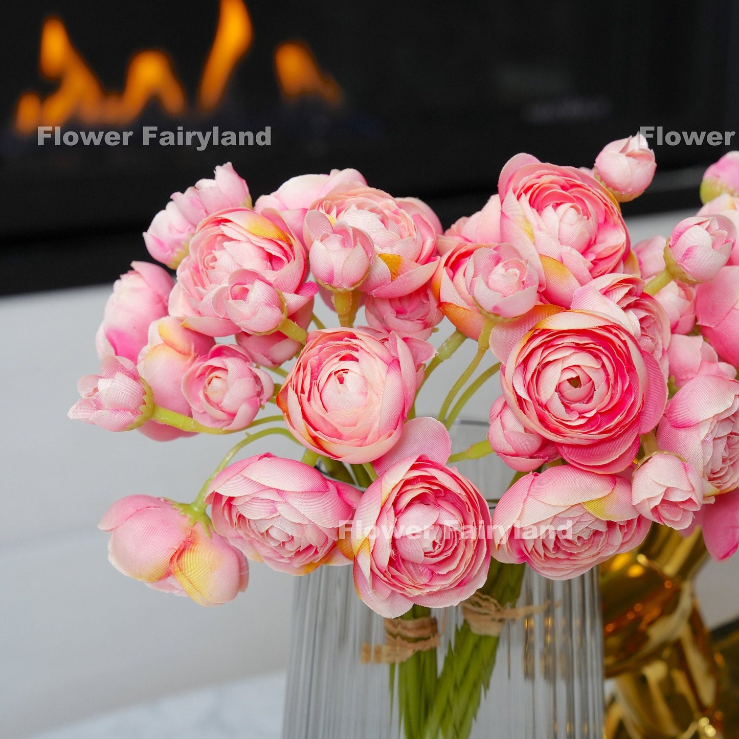 Flamingo pink ranunculus bundle held in hand
