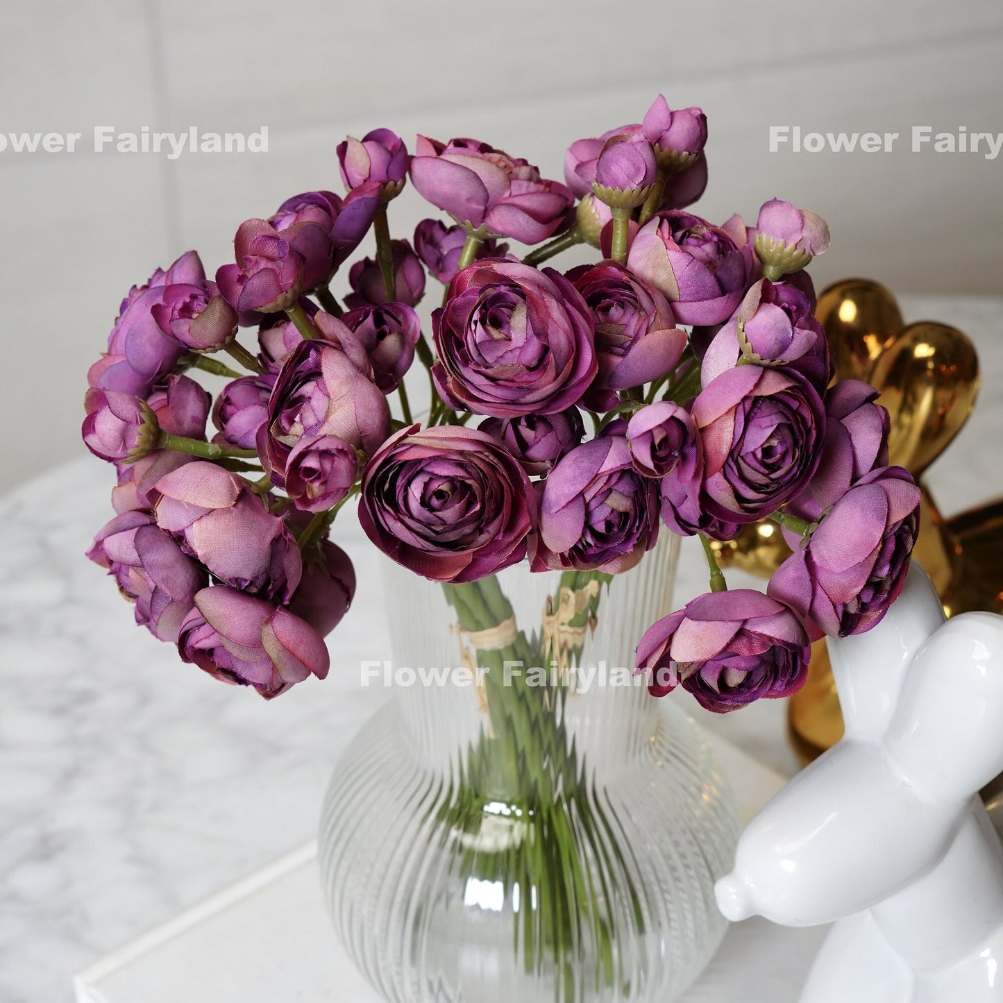 Vintage purple ranunculus bundle held in hand