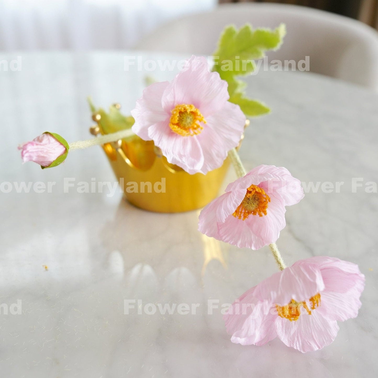 Soft pink poppy in yellow cup detail