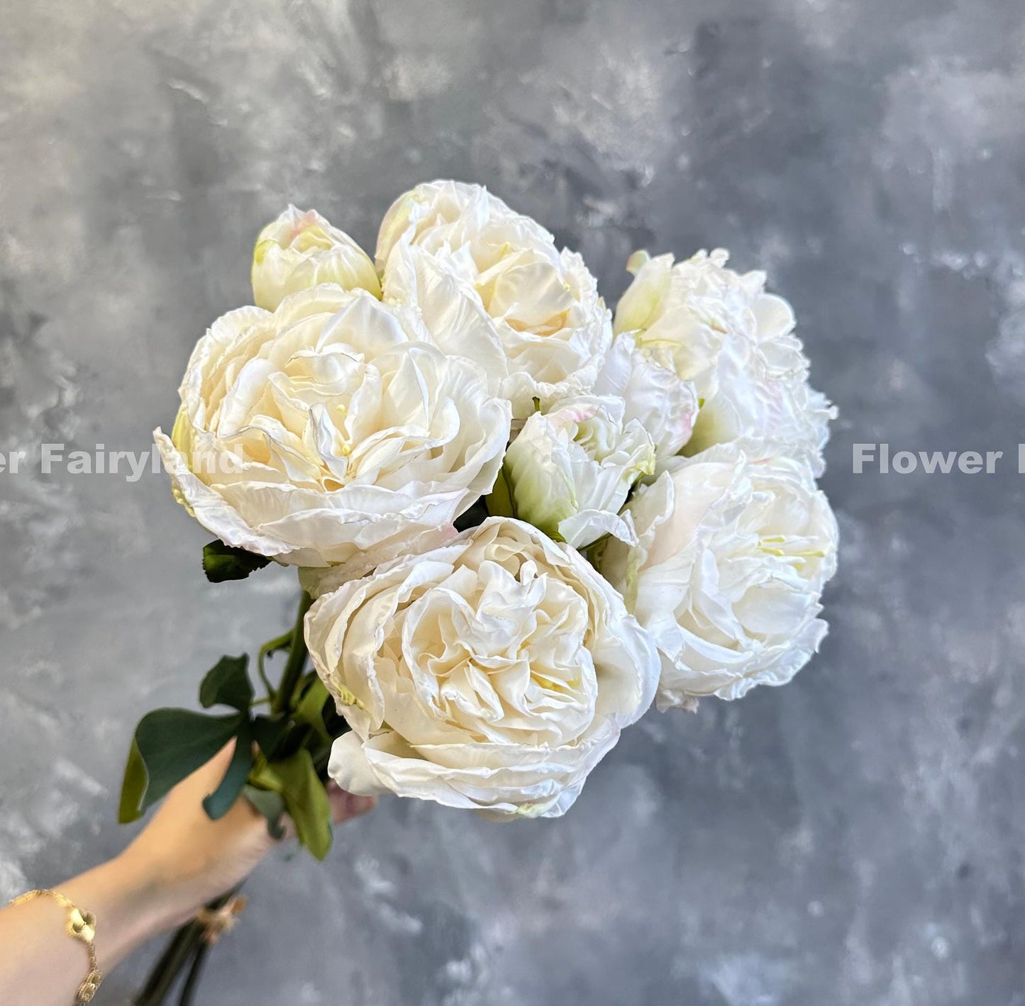 Milky white dried look peony and rose bouquet close-up
