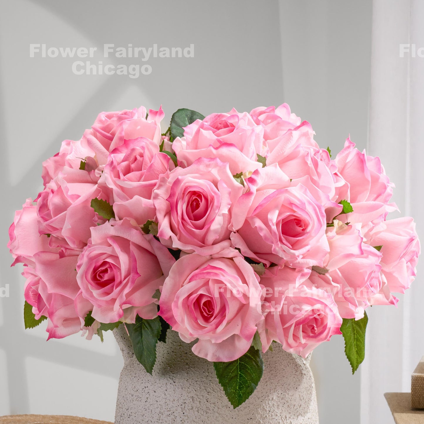 Single pink rose stem from bouquet