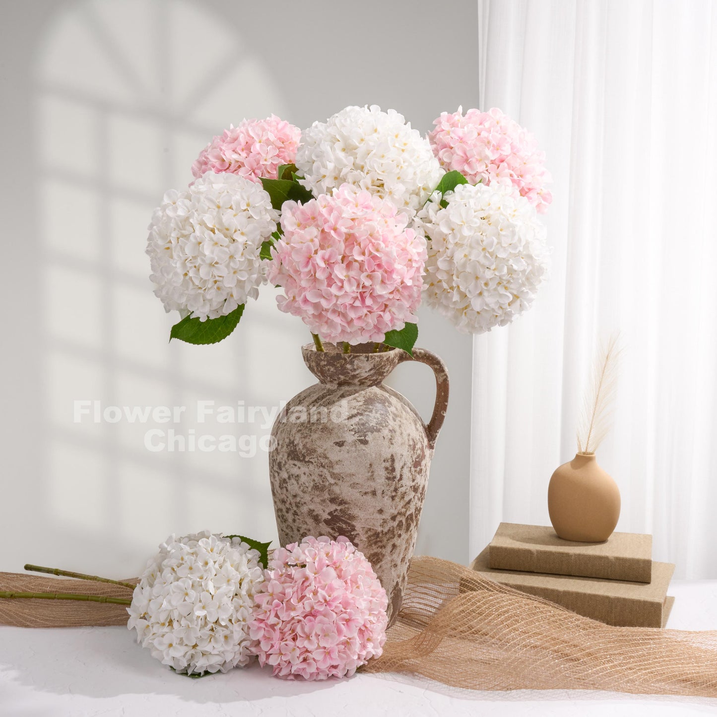 White Grand Bloom faux hydrangea arrangement in a vase