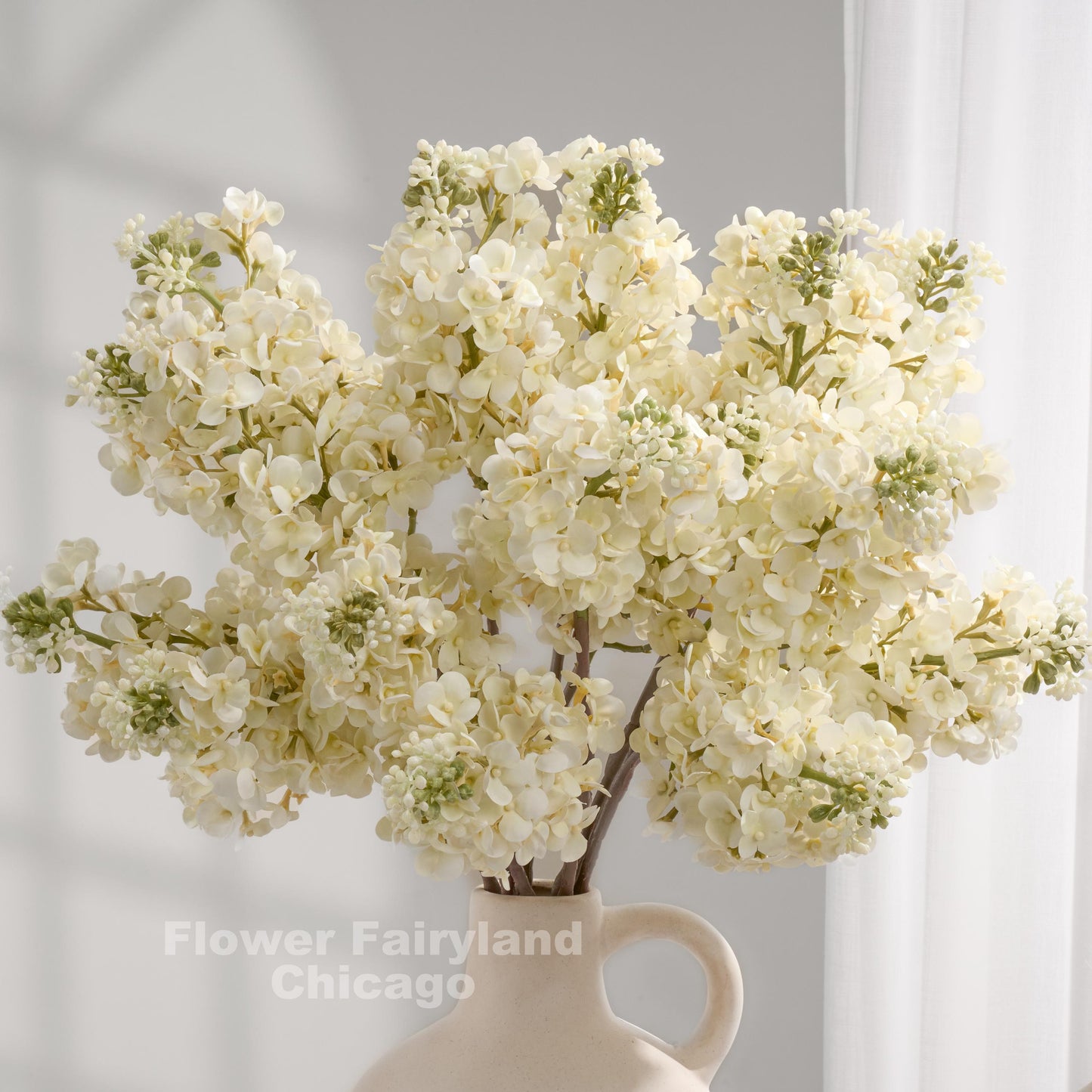 Ivory lilac arrangement in vase