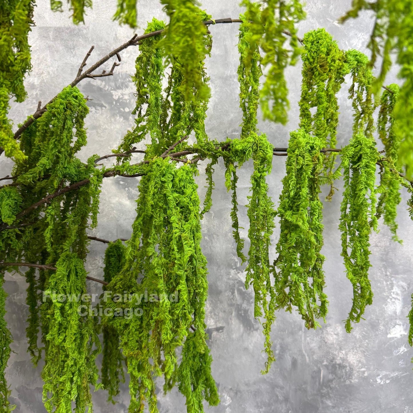 Faux weeping moss branch decor idea