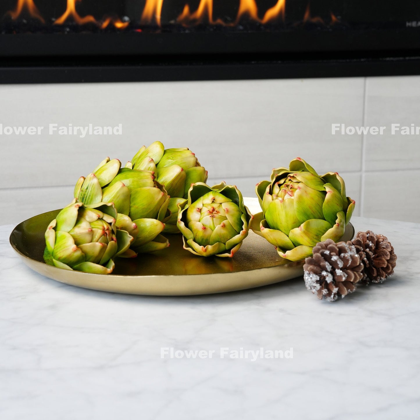 Green faux artichoke styled in bowl