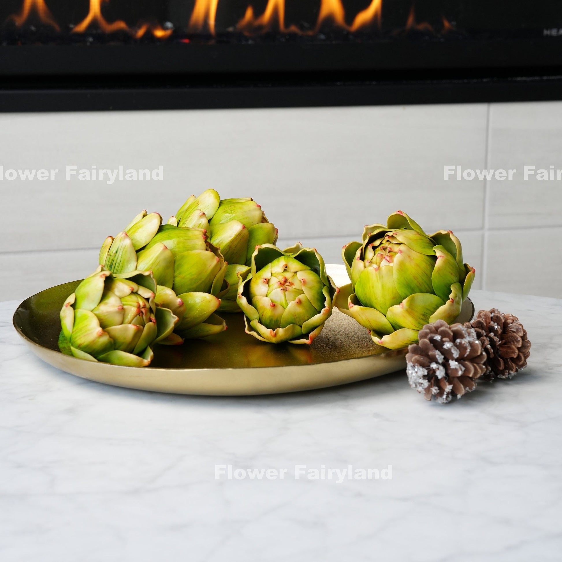 Green faux artichoke styled in bowl