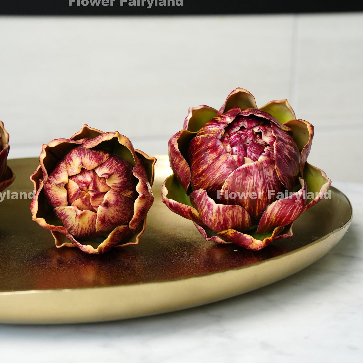 Red faux artichoke styled in bowl