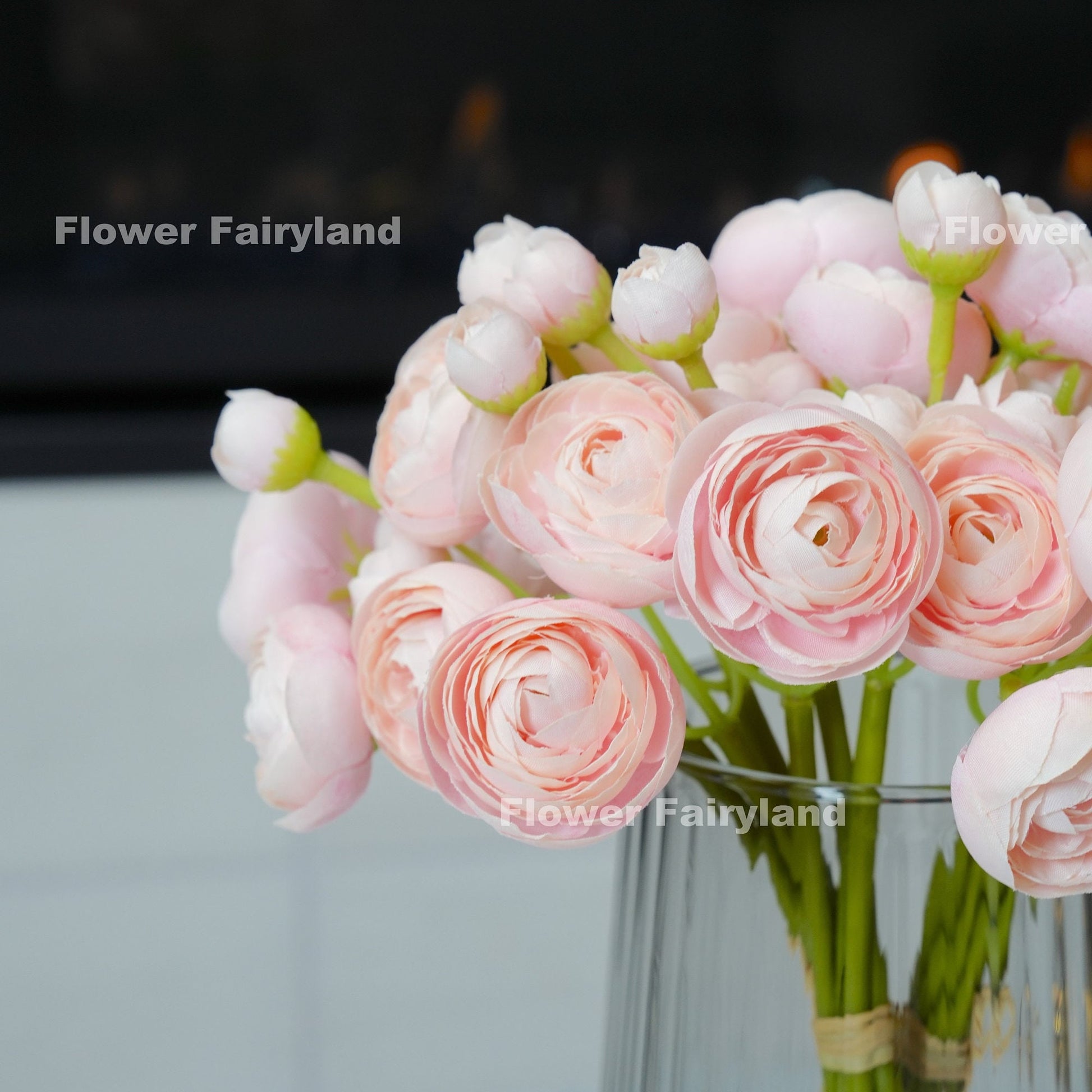 Soft pink mini ranunculus bundle tied with raffia