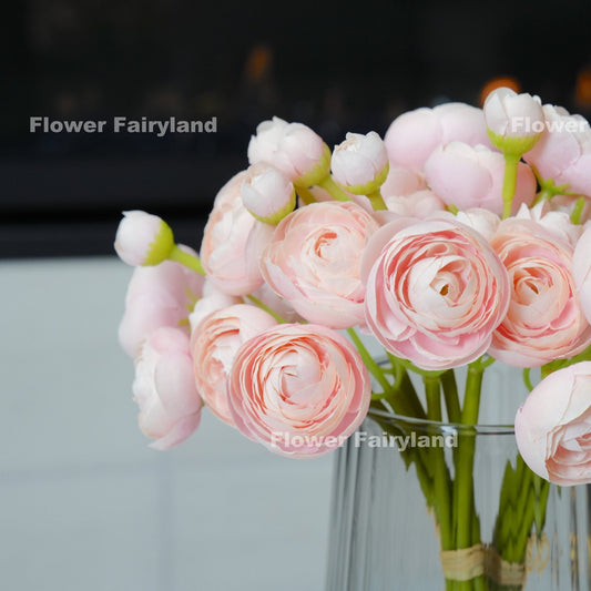 Soft pink mini ranunculus bundle tied with raffia