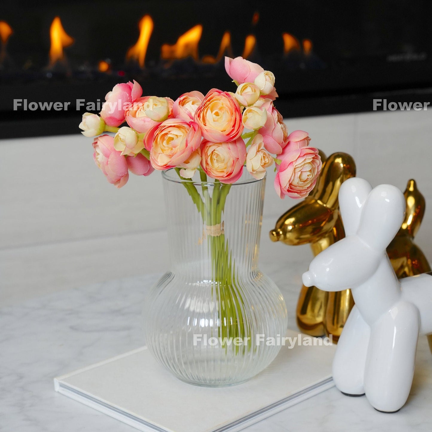 Pink peach mini ranunculus styled in a vase
