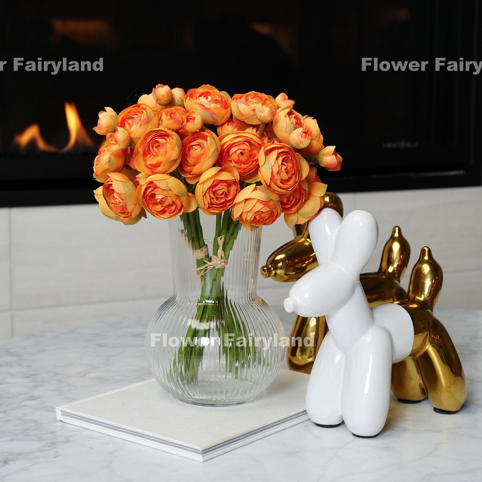 Gradual orange mini ranunculus bundle tied with raffia