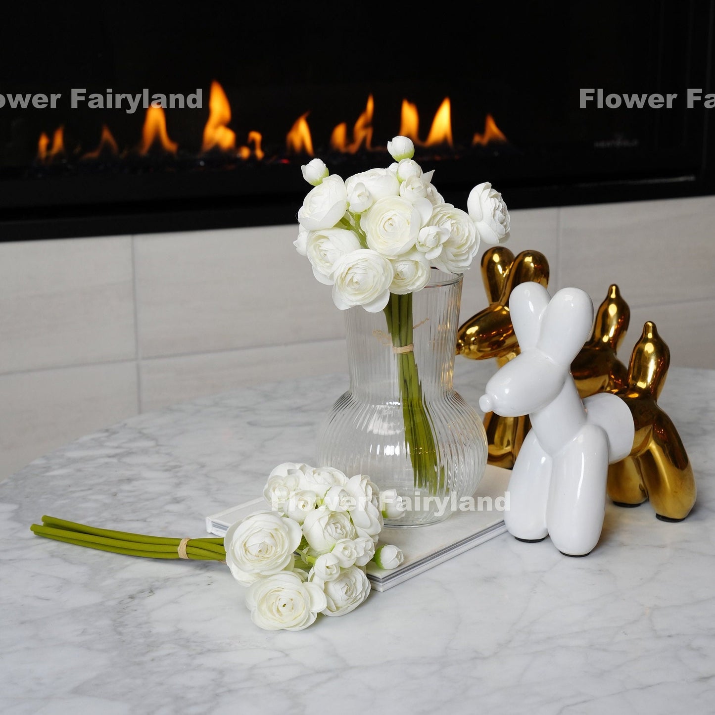 White mini ranunculus styled in a vase