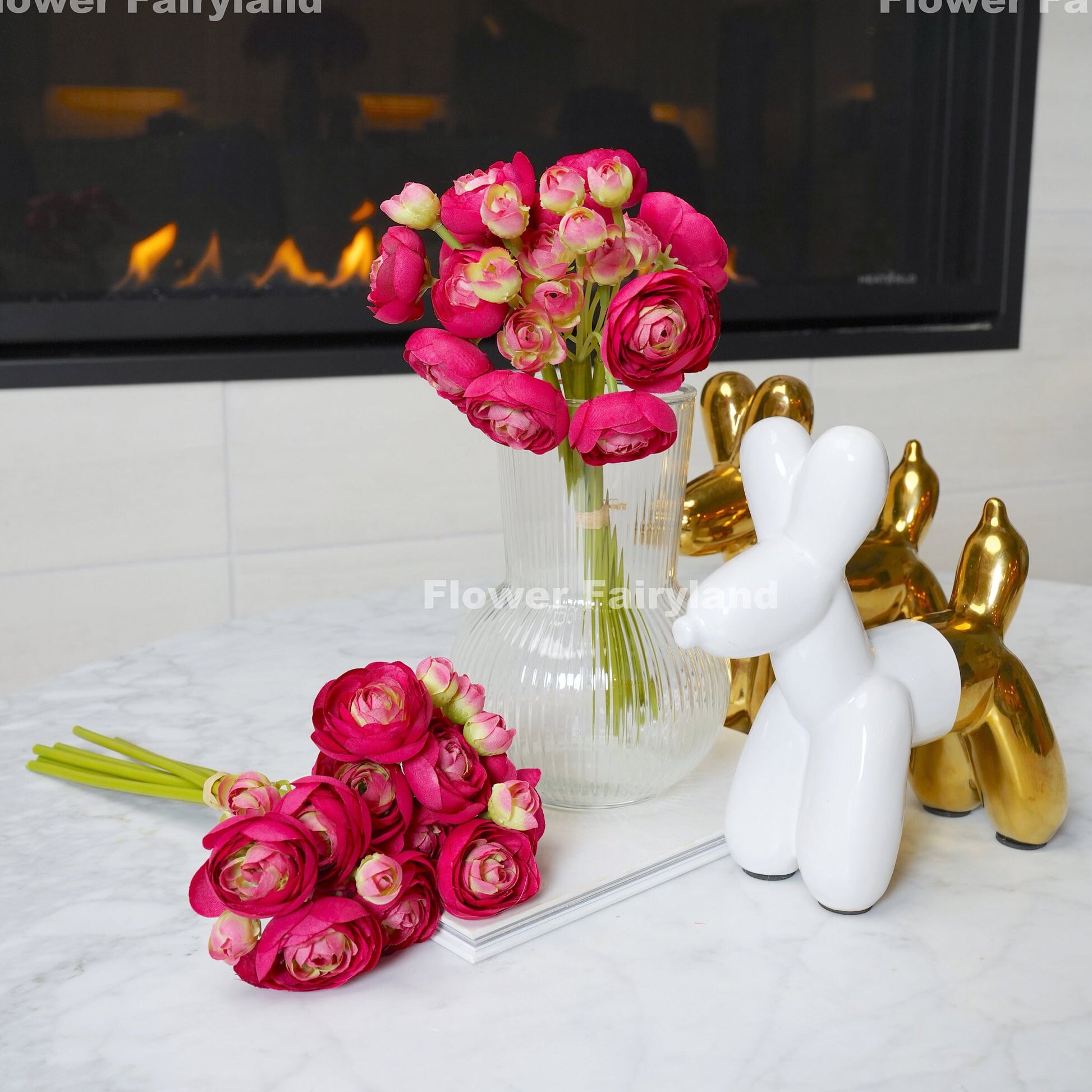 Magenta pink mini ranunculus styled in a vase