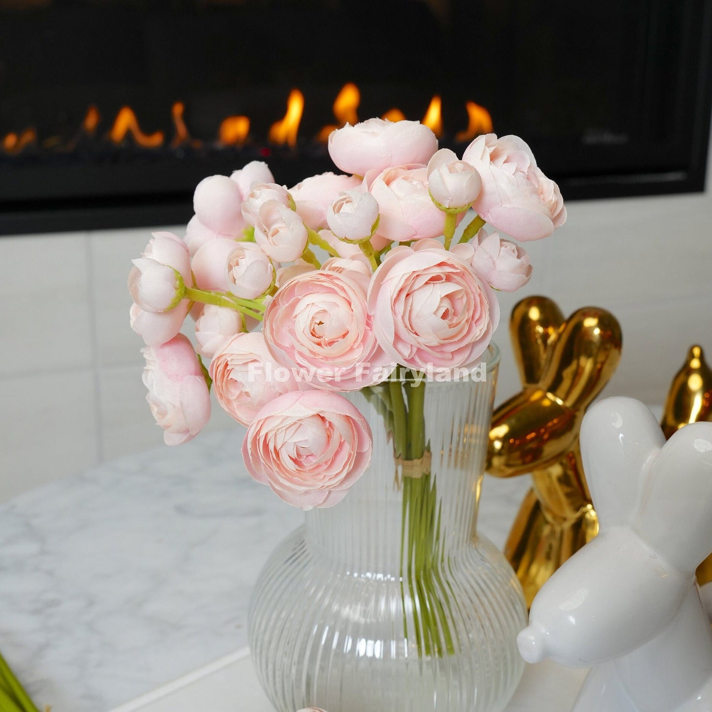 Soft pink mini ranunculus blooms close-up