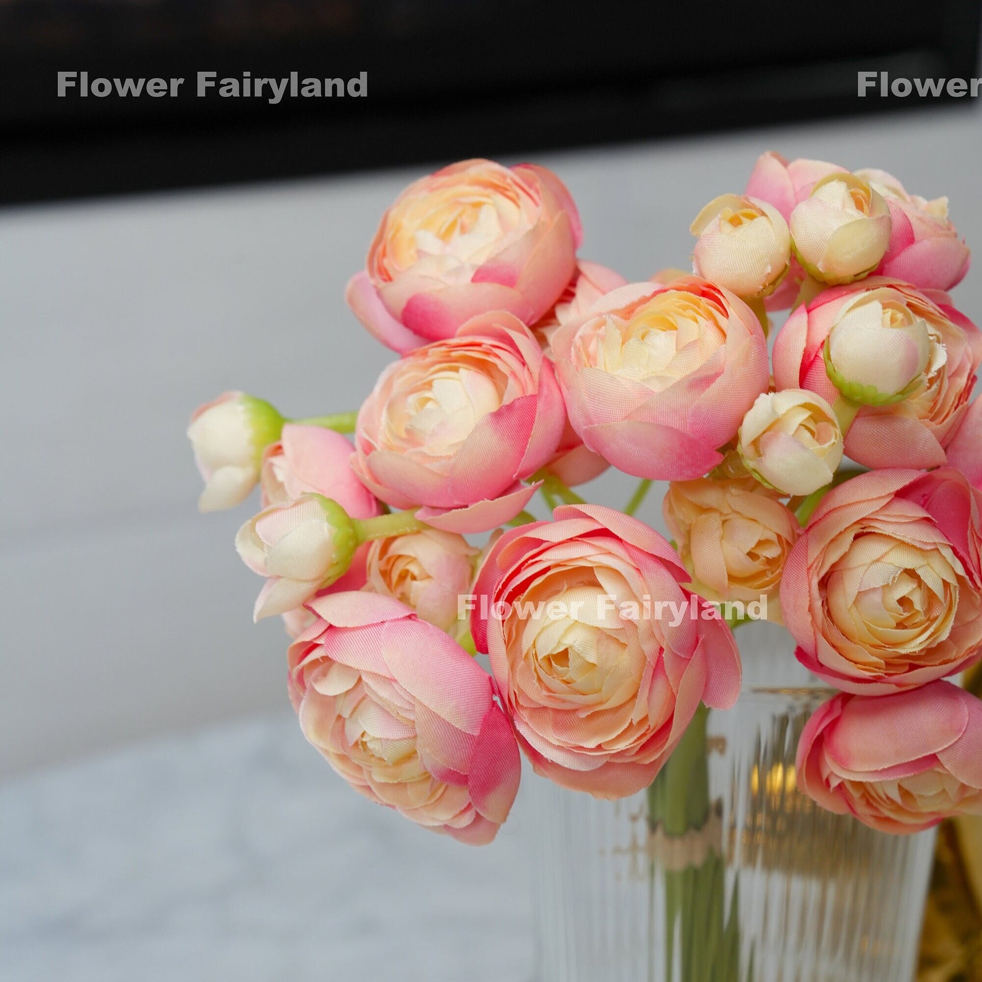 Pink peach ranunculus bundle held in hand