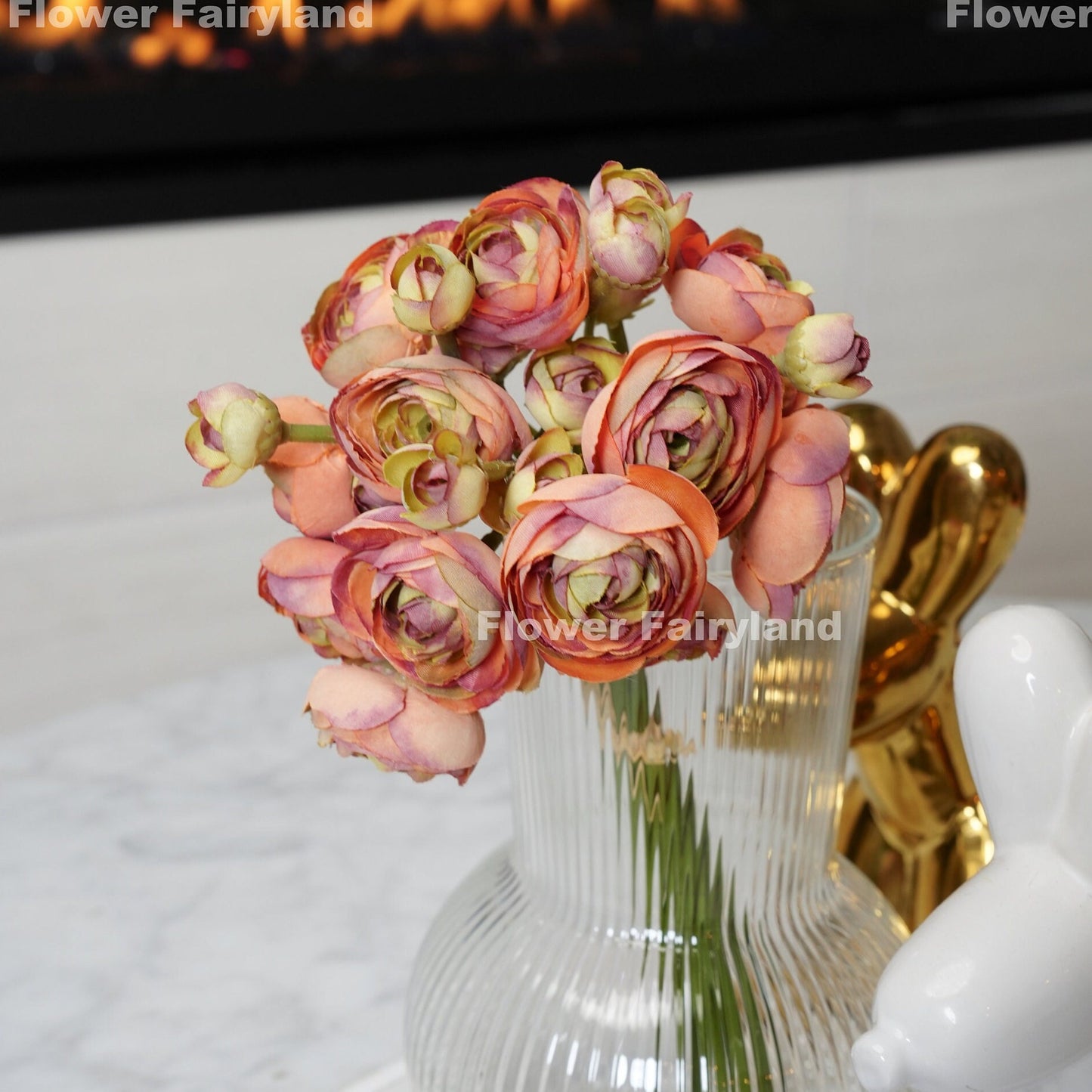 Pale burnt orange ranunculus blooms close-up