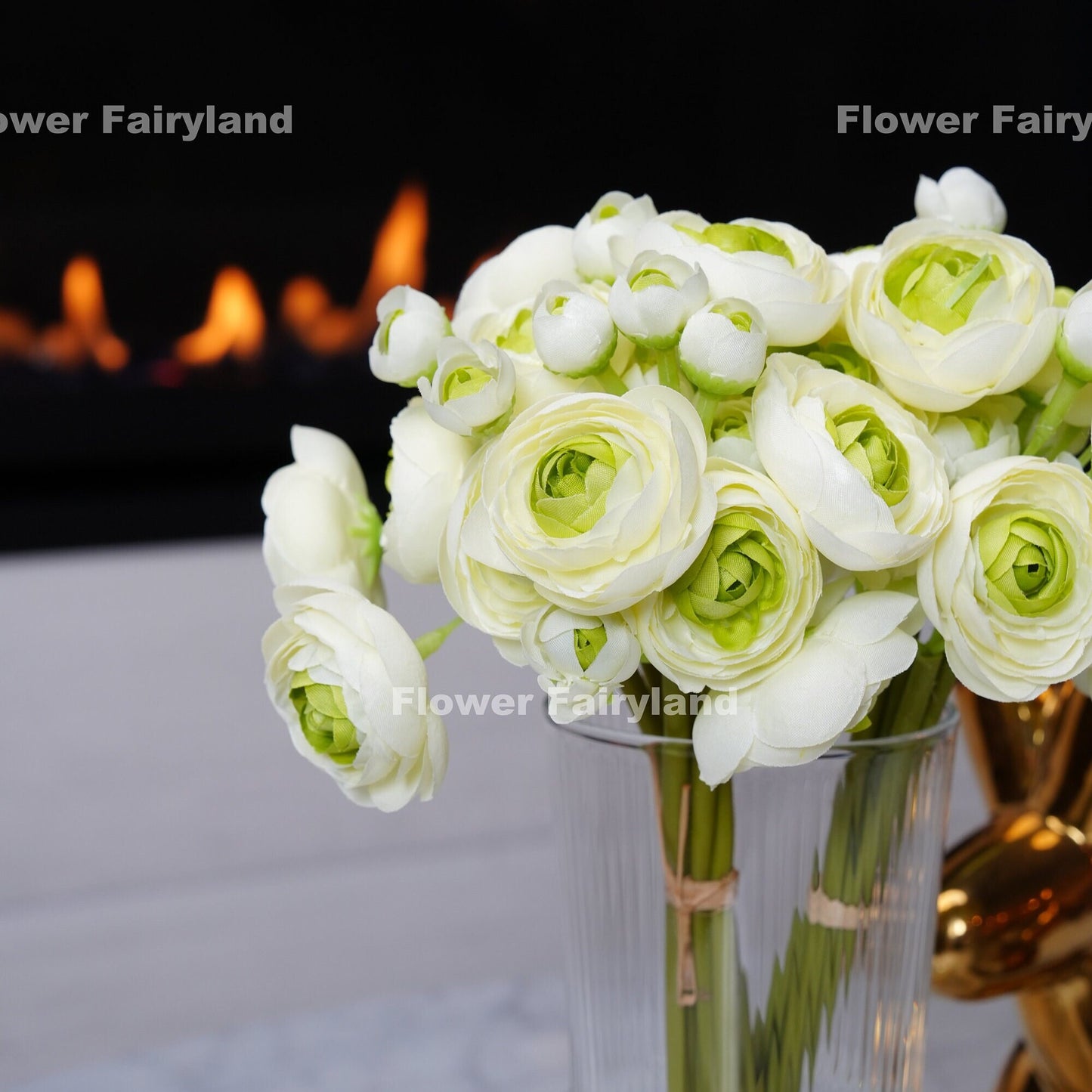 White green ranunculus bundle held in hand