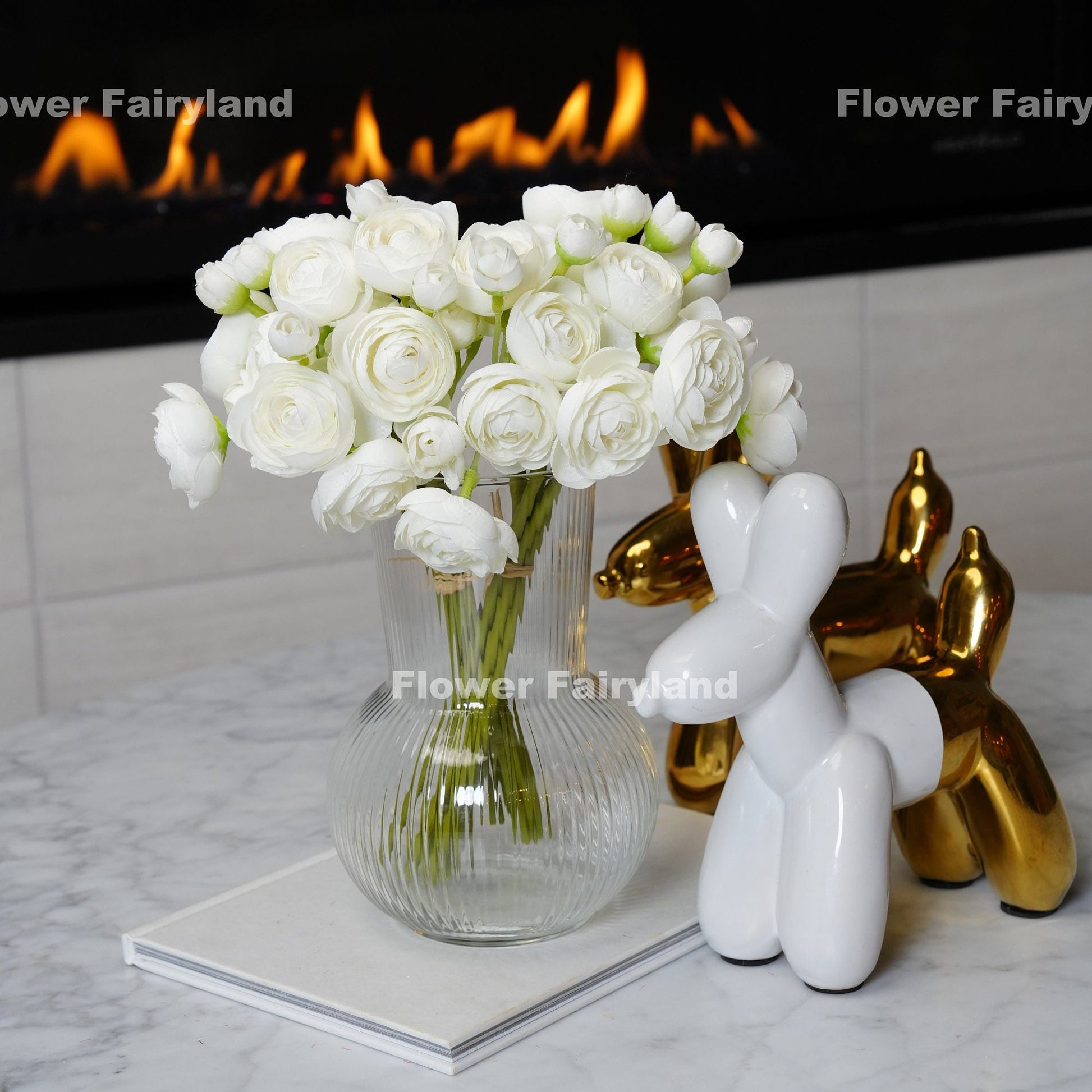 White mini ranunculus bundle held in hand