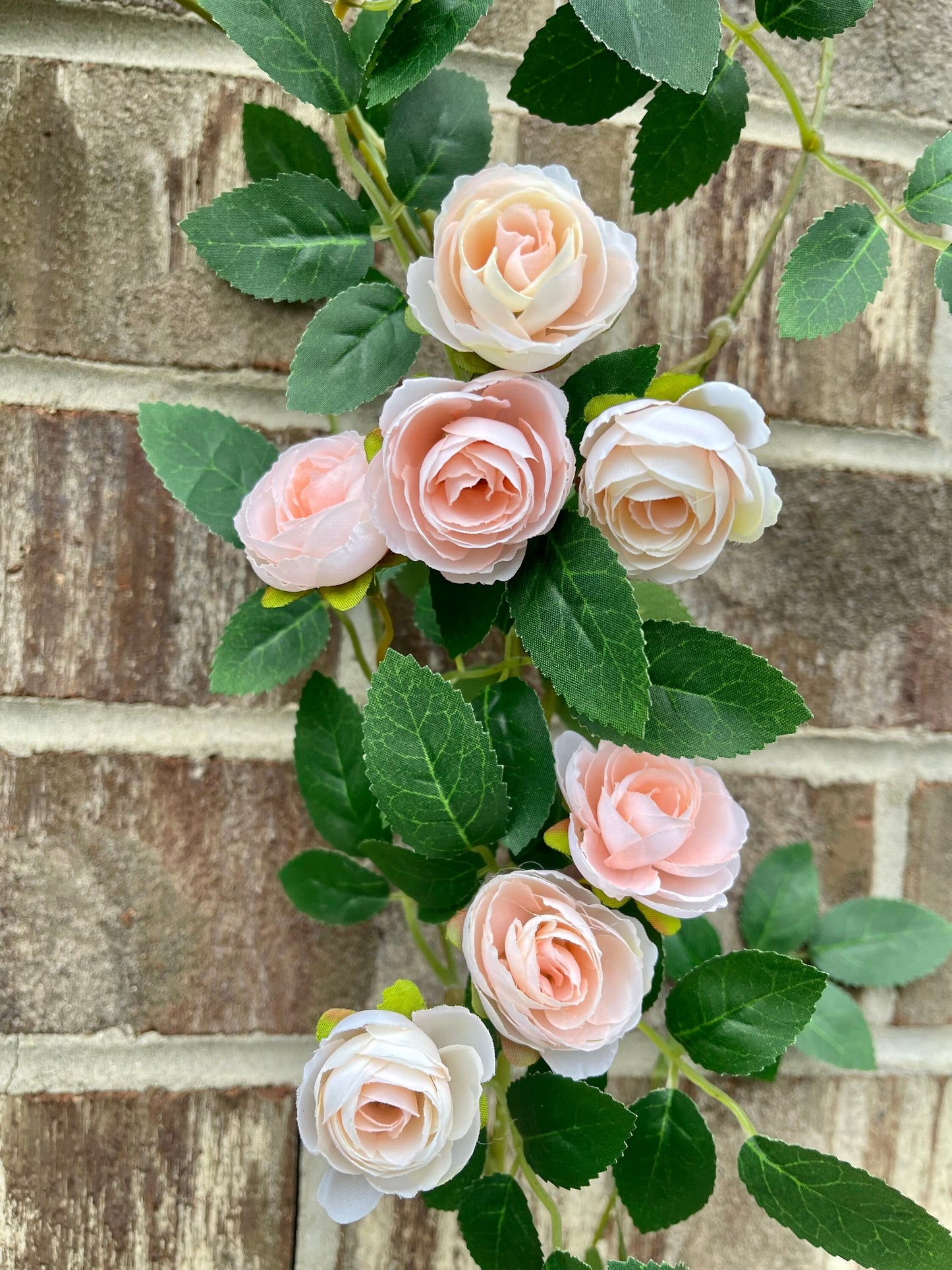 Blush pink rose garland draped in decor