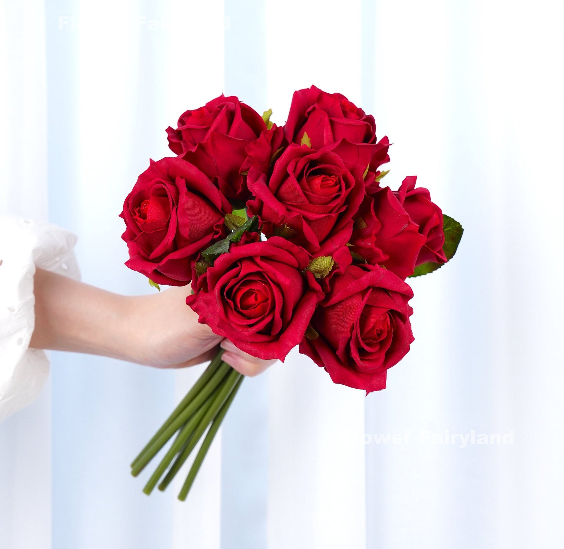 Red rose bouquet held in hand