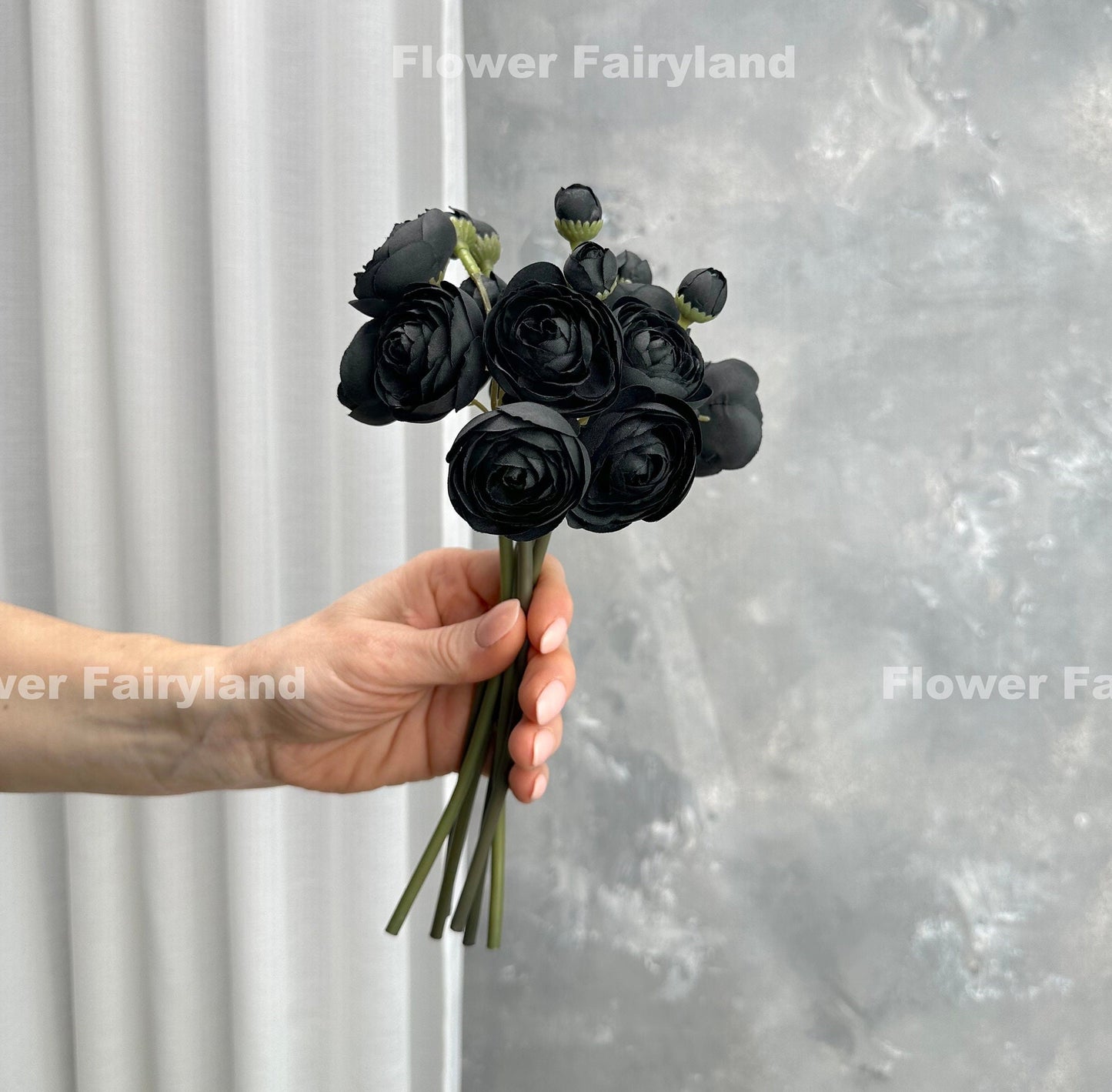 Black mini ranunculus styled in a vase