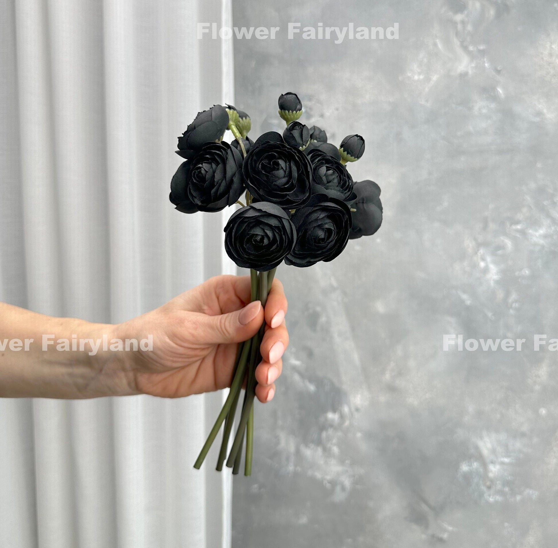 Black mini ranunculus styled in a vase