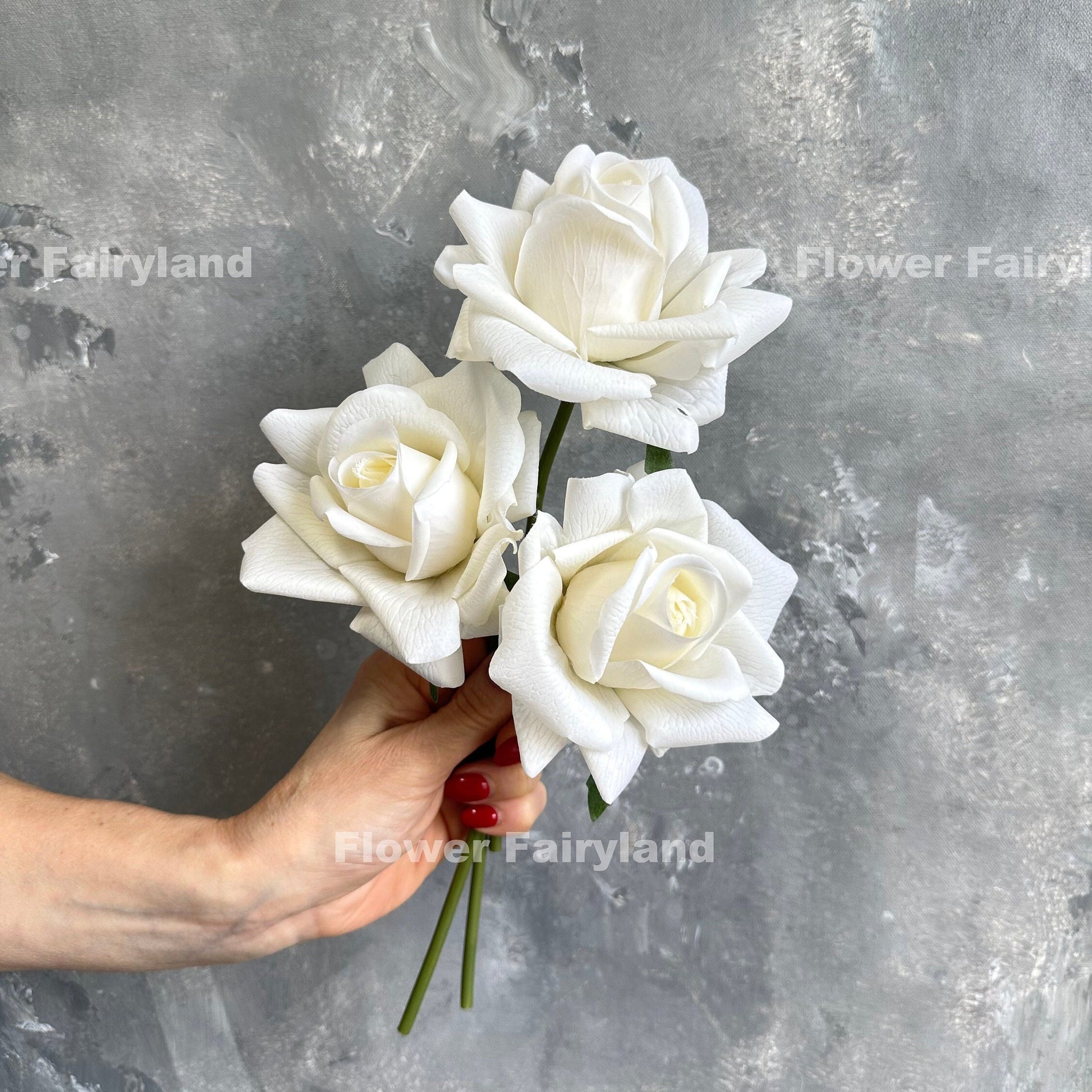 Milky white rose bouquet in hand