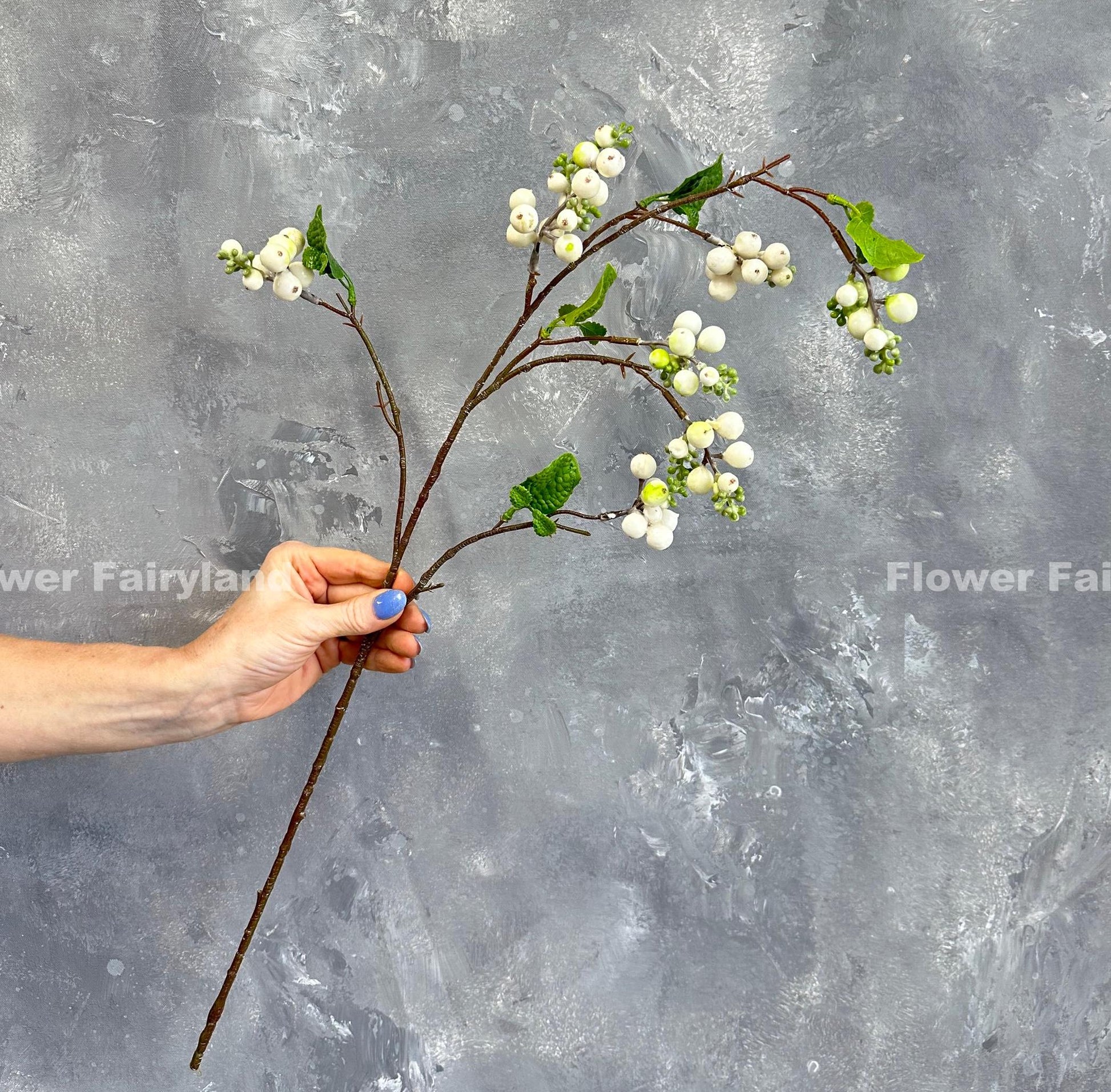 White snowberry branch styled in vase