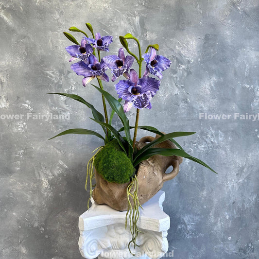 Faux cattleya orchid in purple with leaves and roots