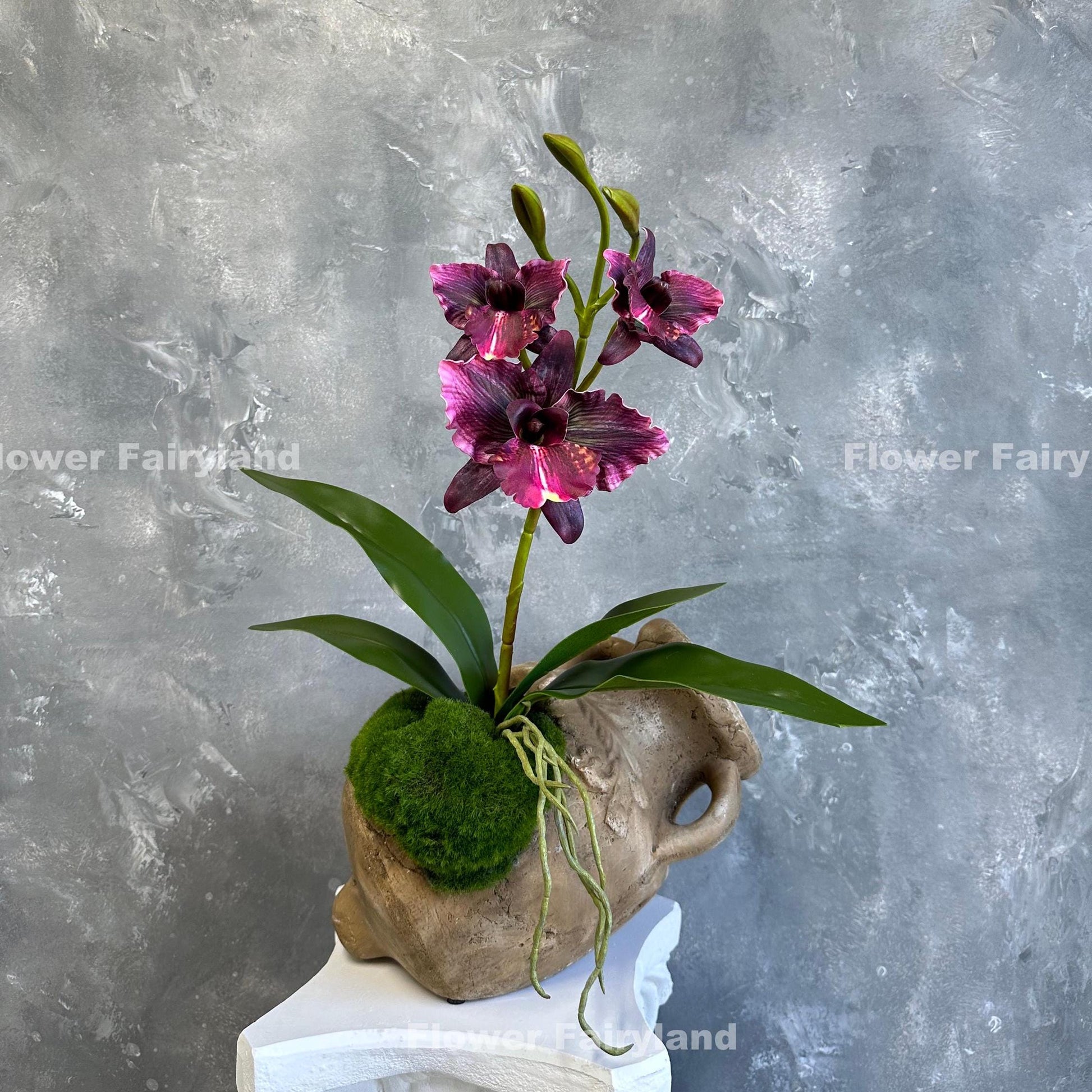 Dark magenta faux cattleya orchid full view