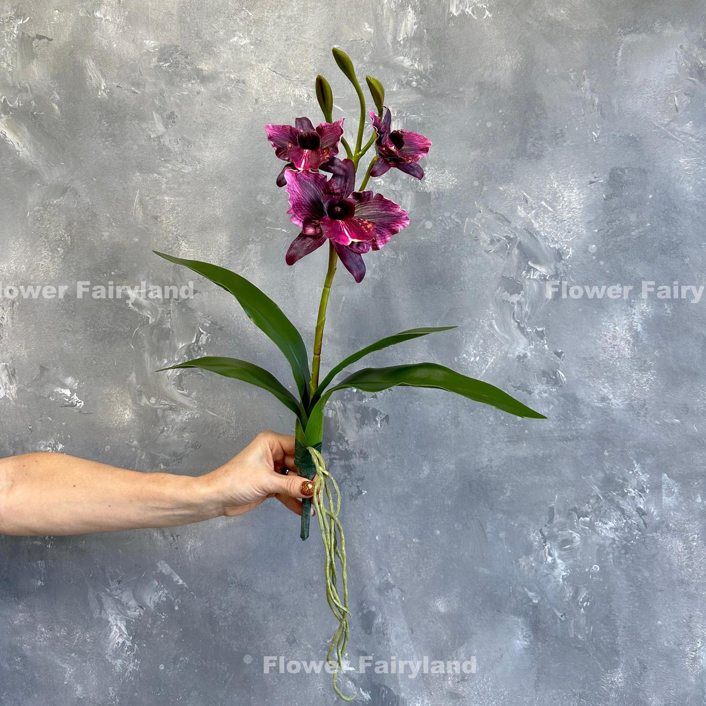 Dark magenta faux cattleya orchid flower detail