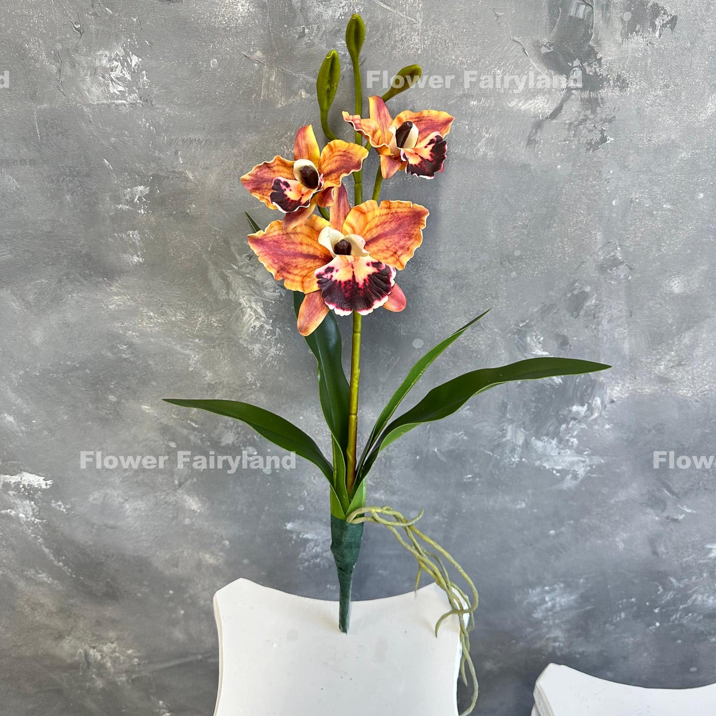 Dark reddish orange faux cattleya orchid full view