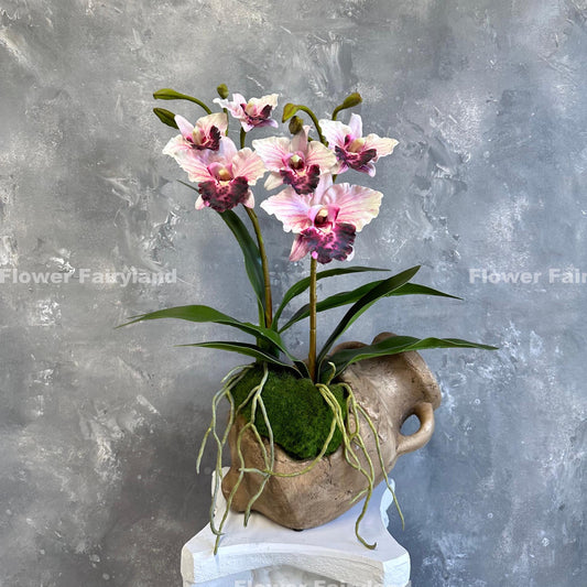 Faux cattleya orchid in pink with leaves and roots