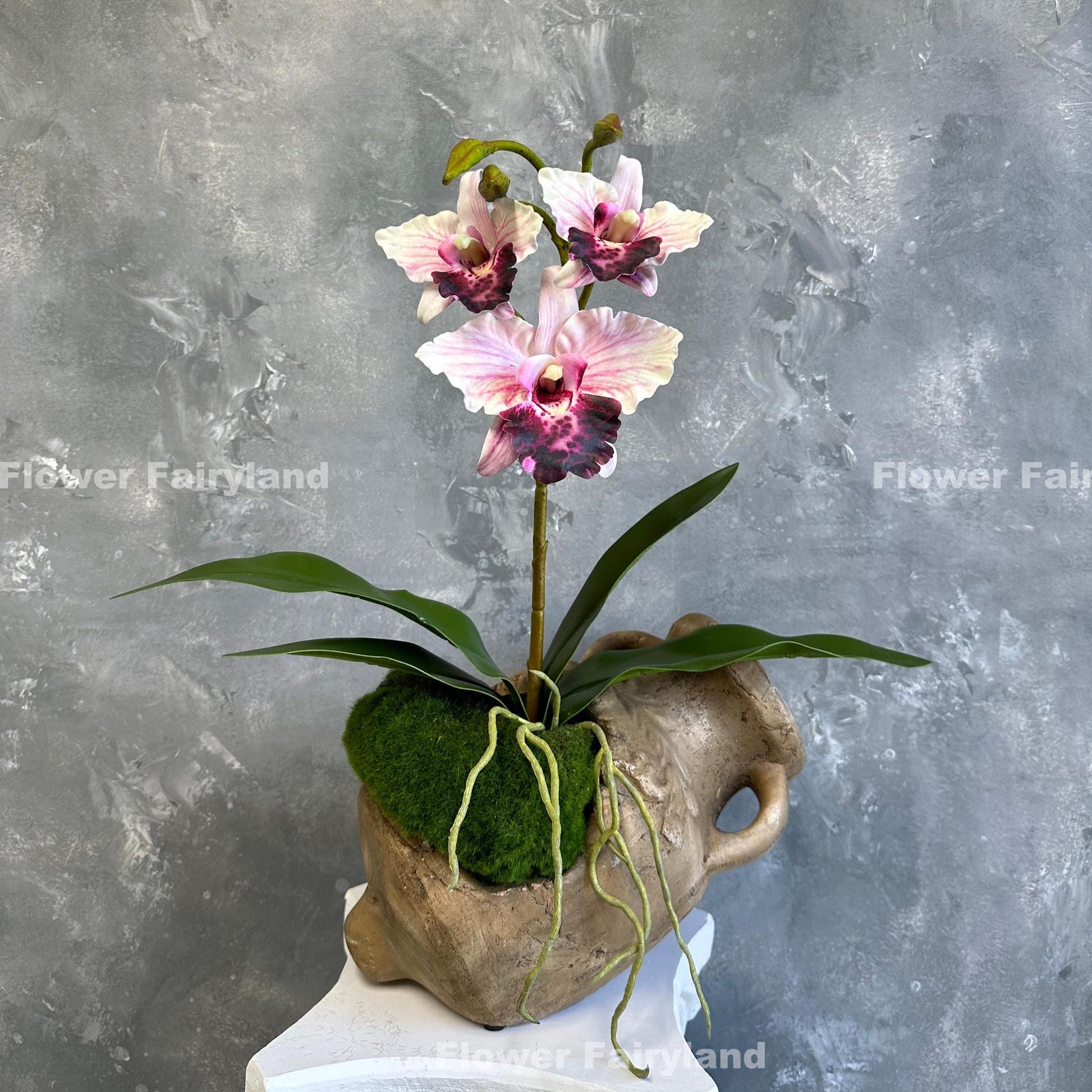 Pink faux cattleya orchid flower detail