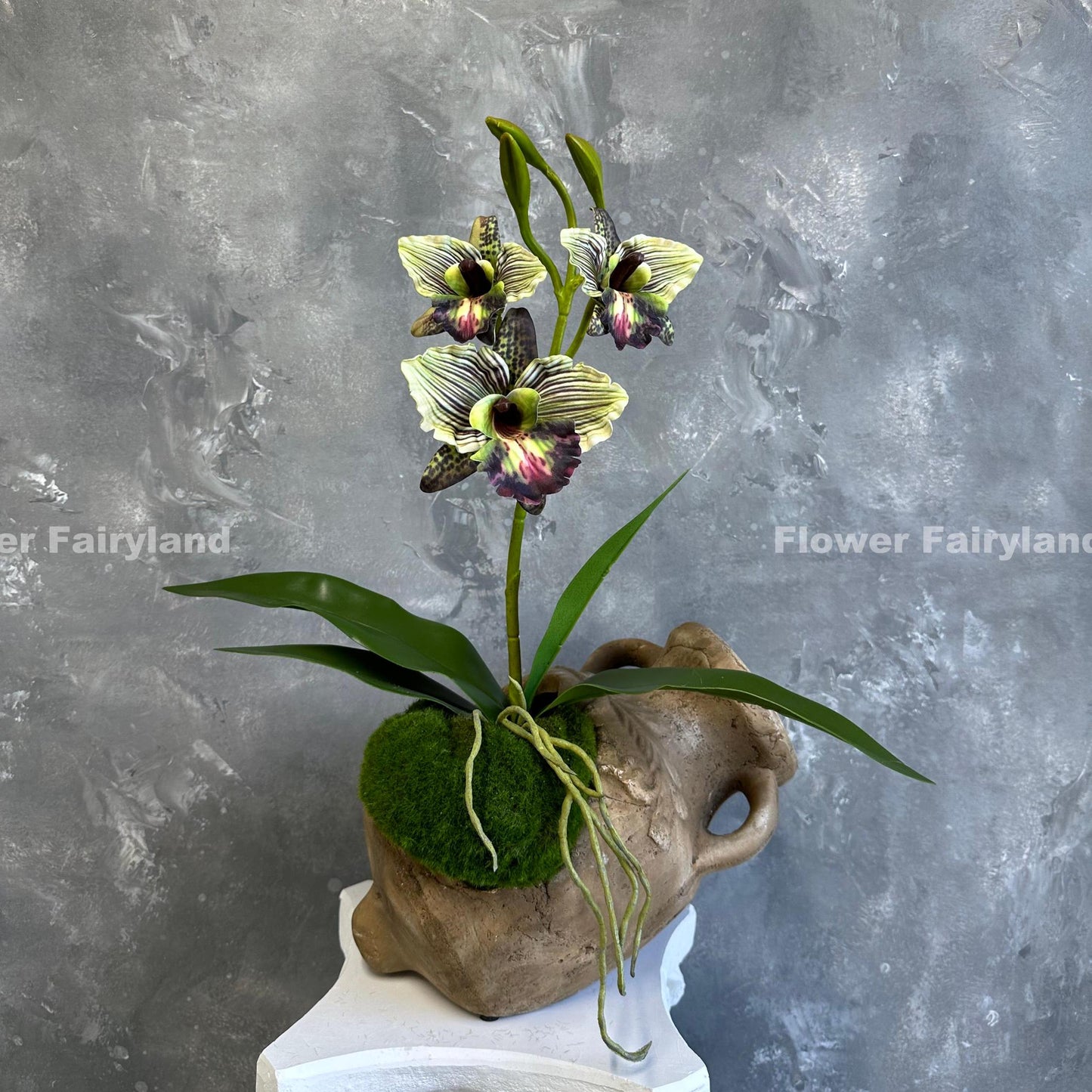 Green faux cattleya orchid blooms