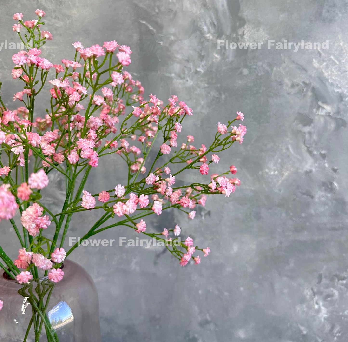 Pink faux baby's breath styled in a vase