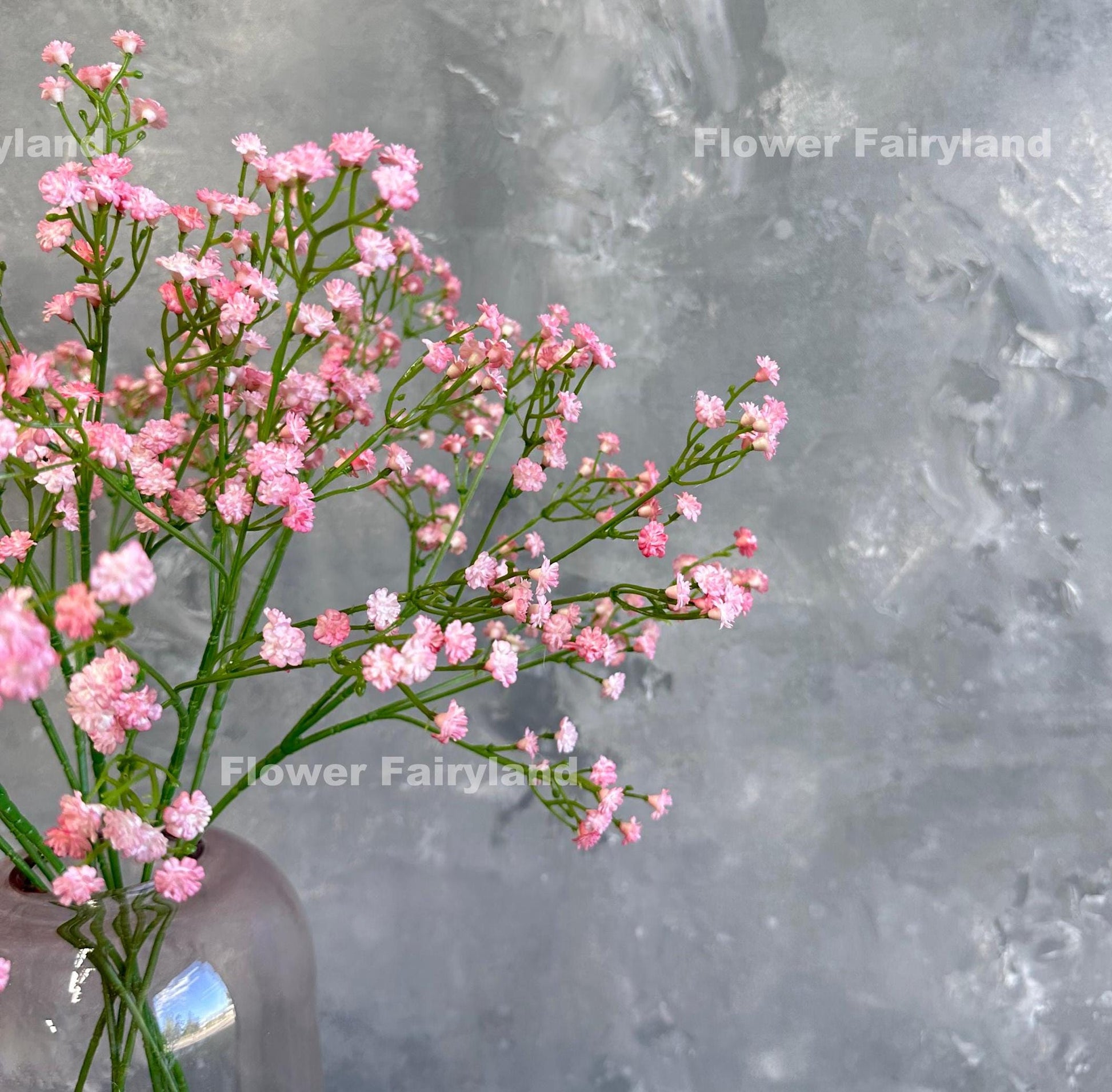 Pink faux baby's breath styled in a vase