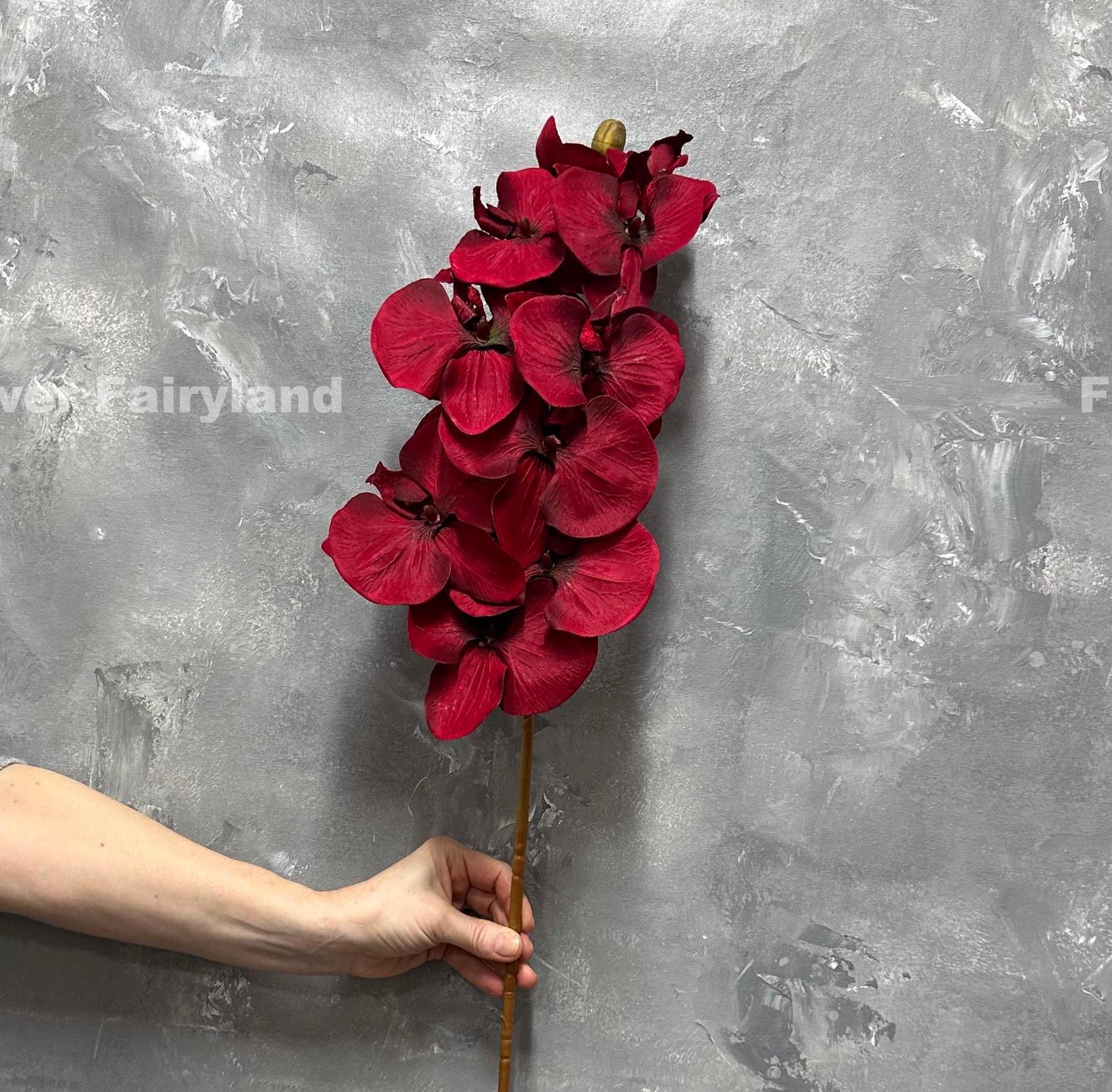 37 inch faux orchid stem with ten huge deep red blooms held upright