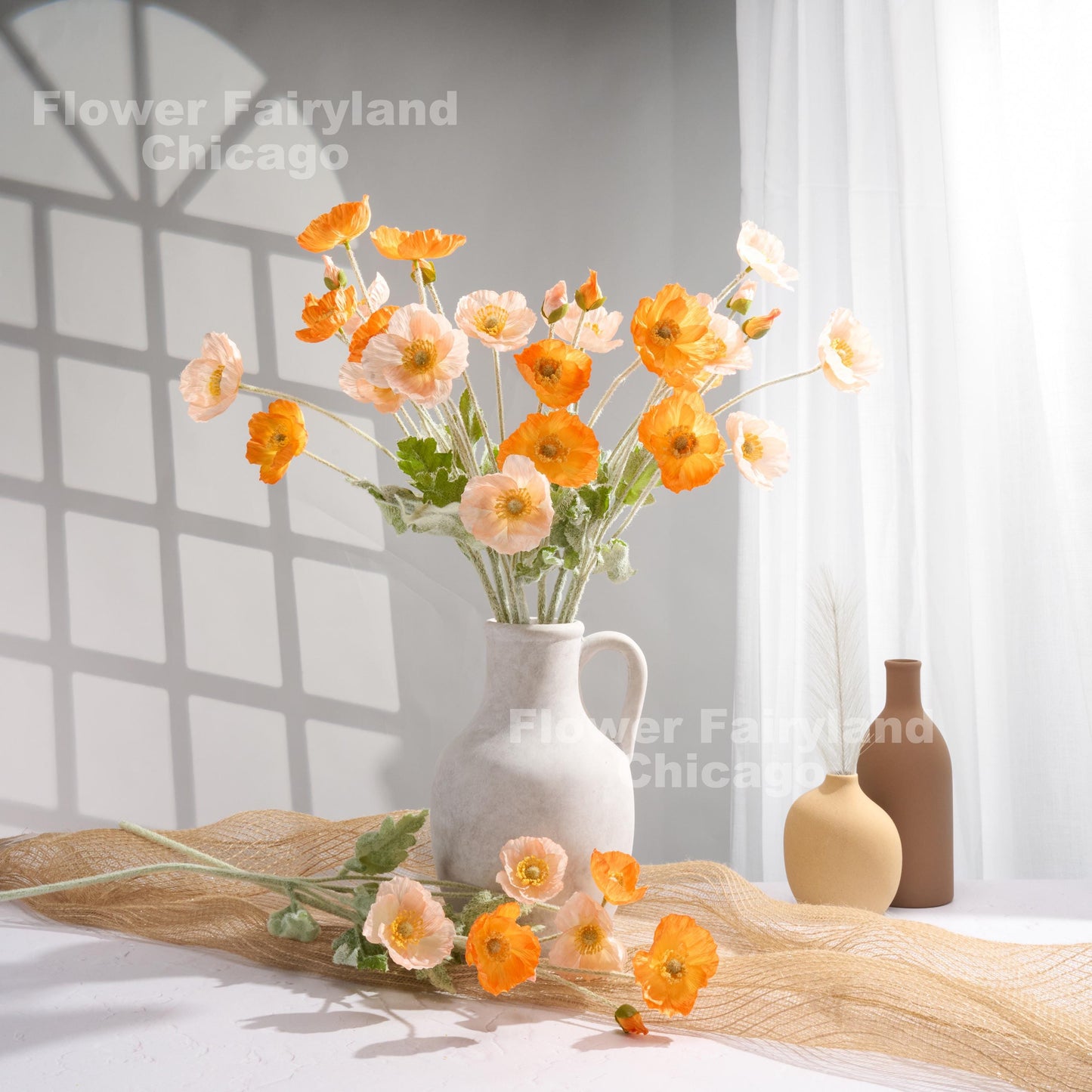 Orange poppy arrangement in vase