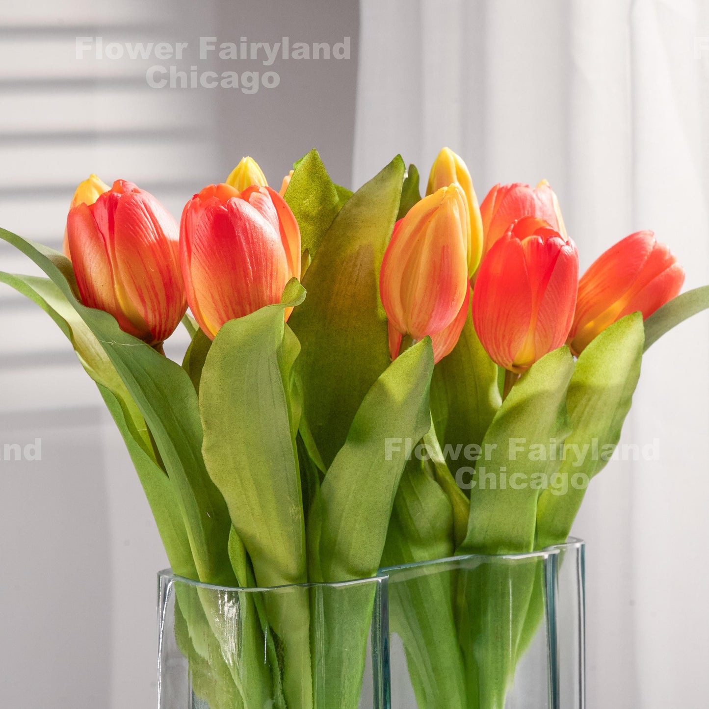 Orange tulips styled in a vase
