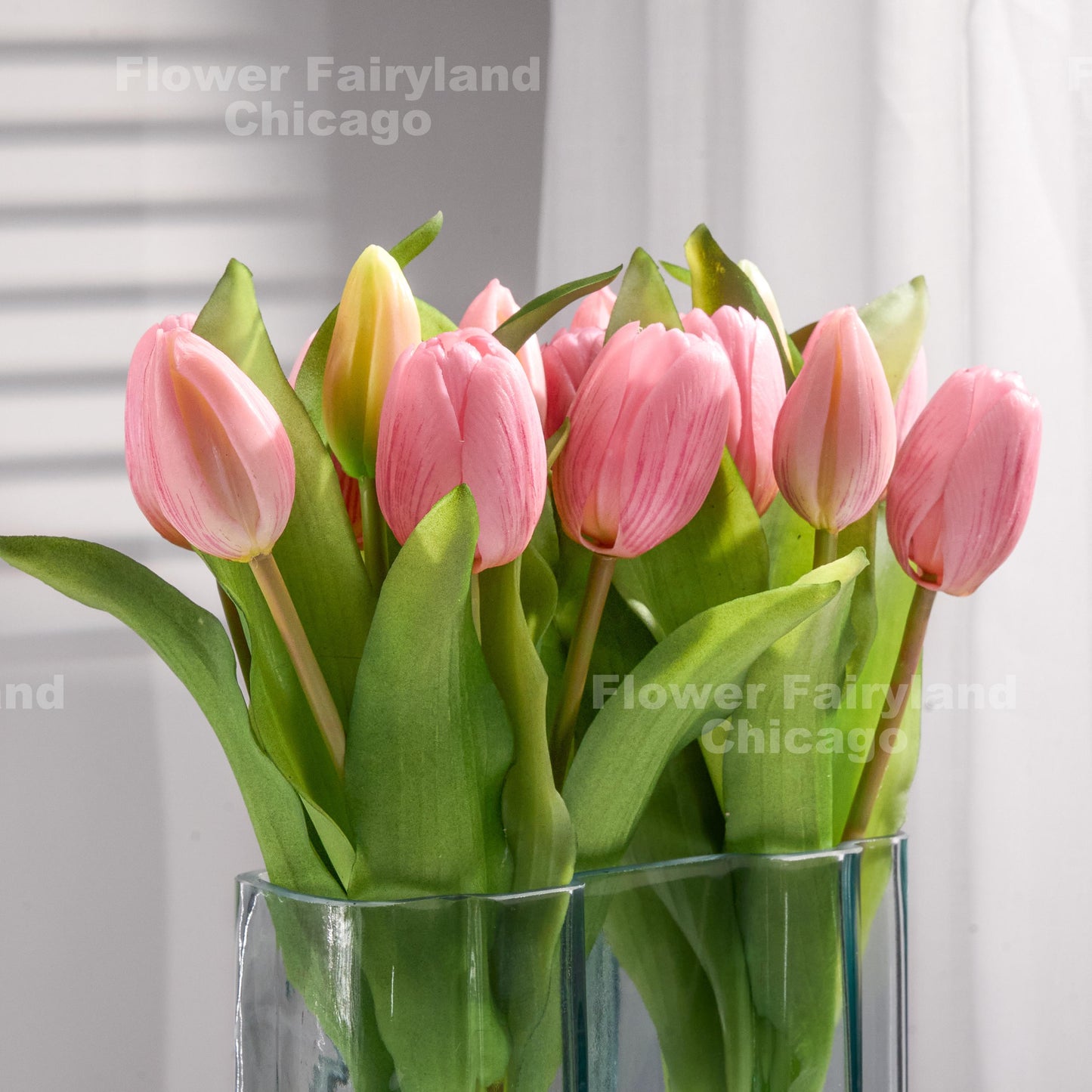 Mauve pink tulips styled in a vase