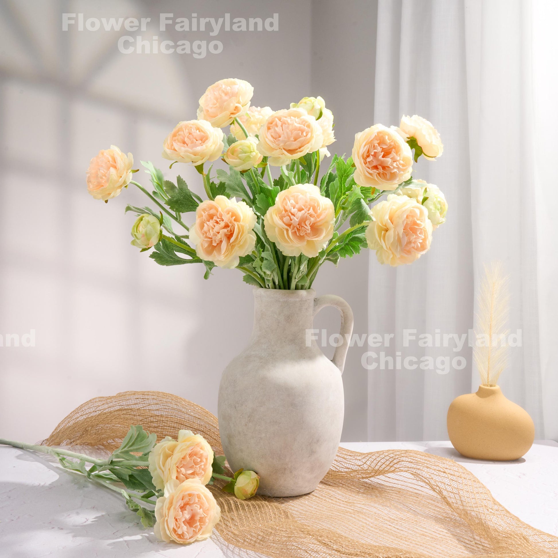 Gradient peach ranunculus arrangement