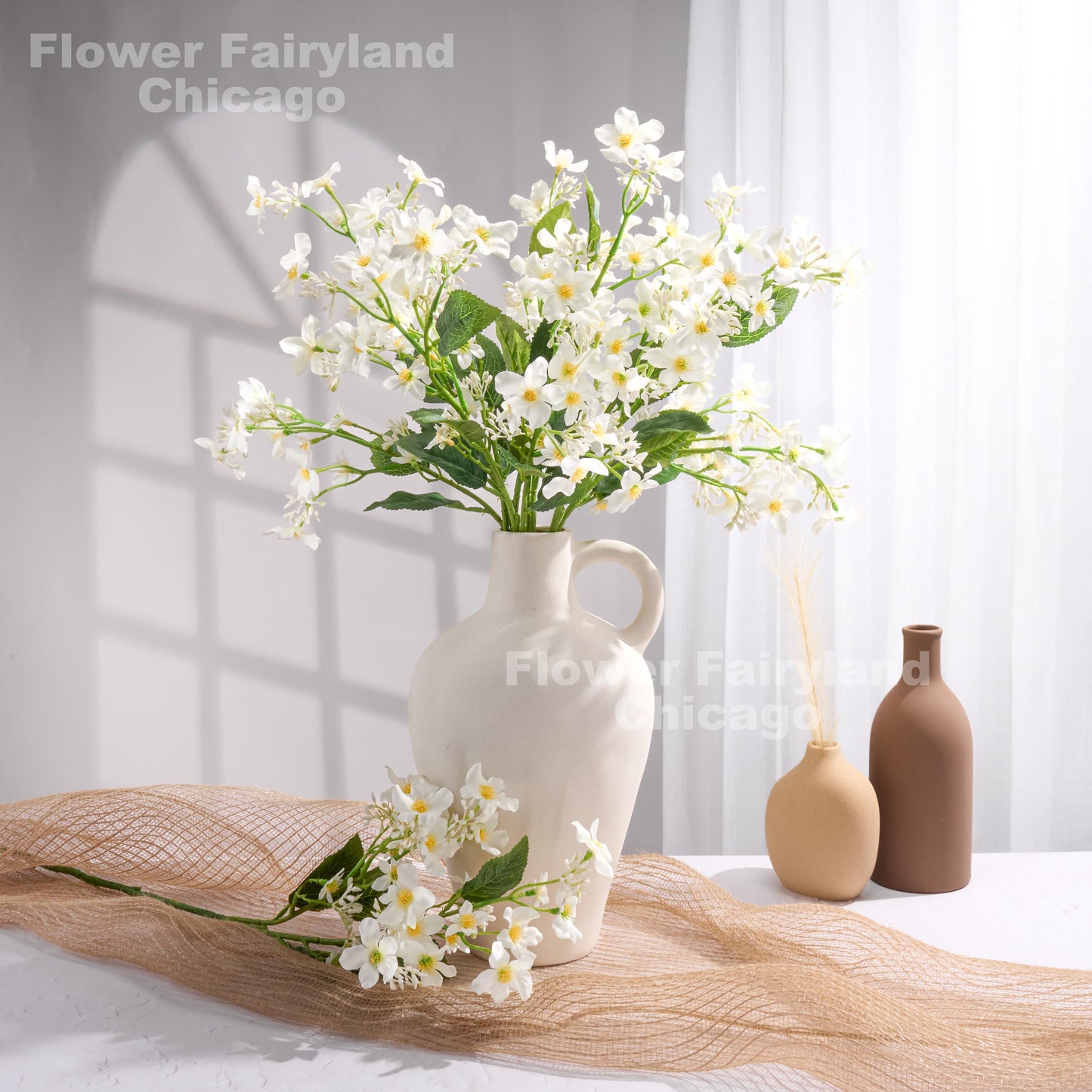 White faux Vernicia flower arrangement
