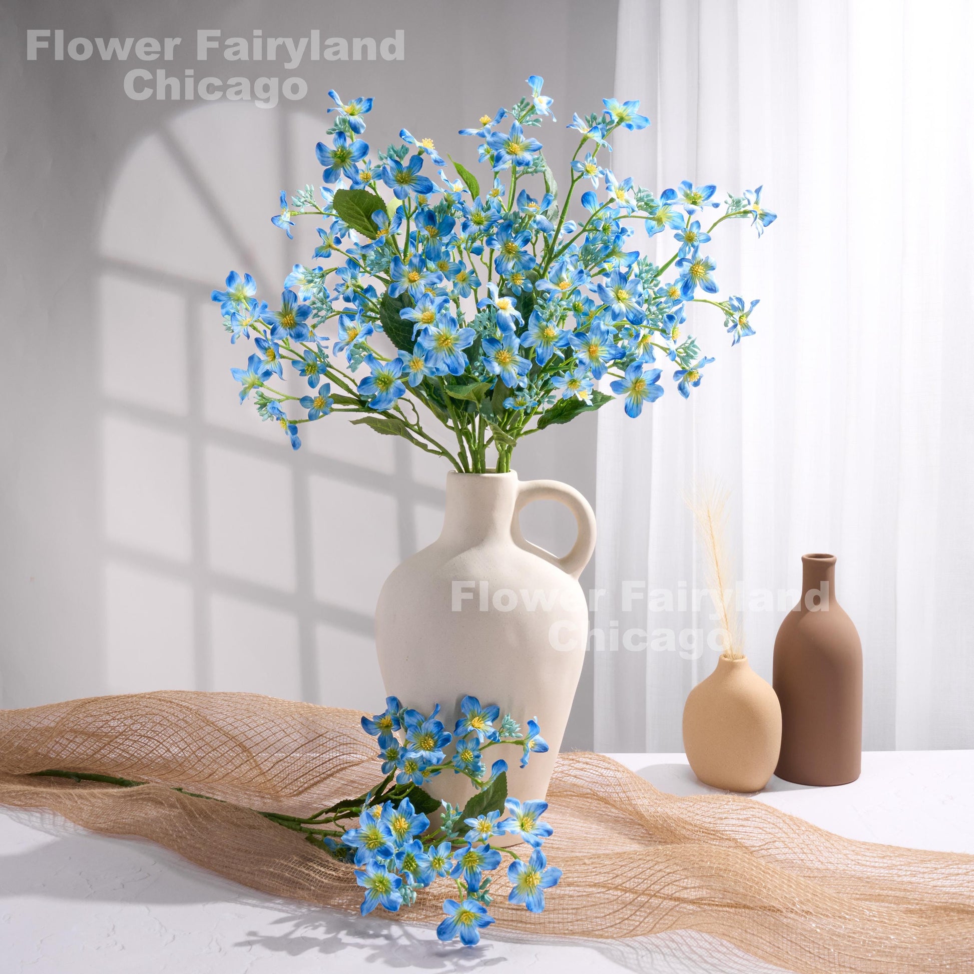 Blue faux Vernicia flower arrangement