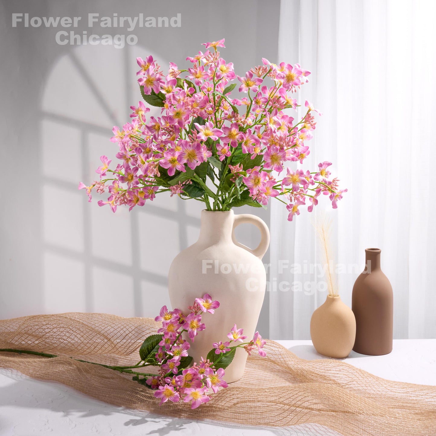 Pinkish lilac faux Vernicia flower arrangement