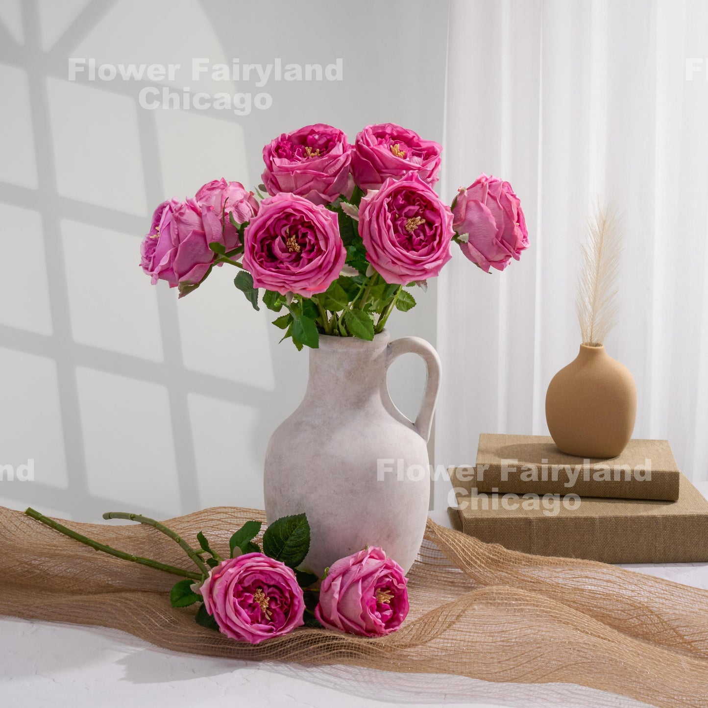 Magenta English roses in a vase