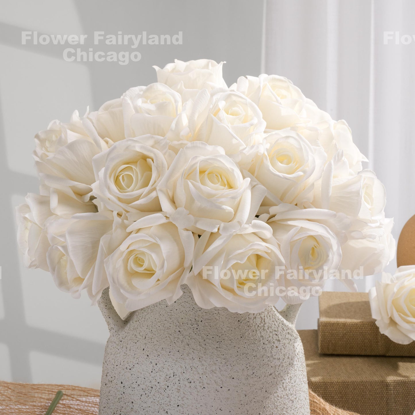 White half bloom roses styled in vase