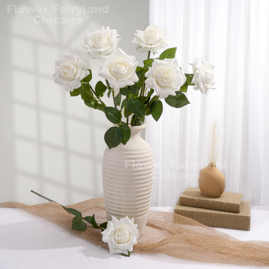 White roses styled in a home decor scene