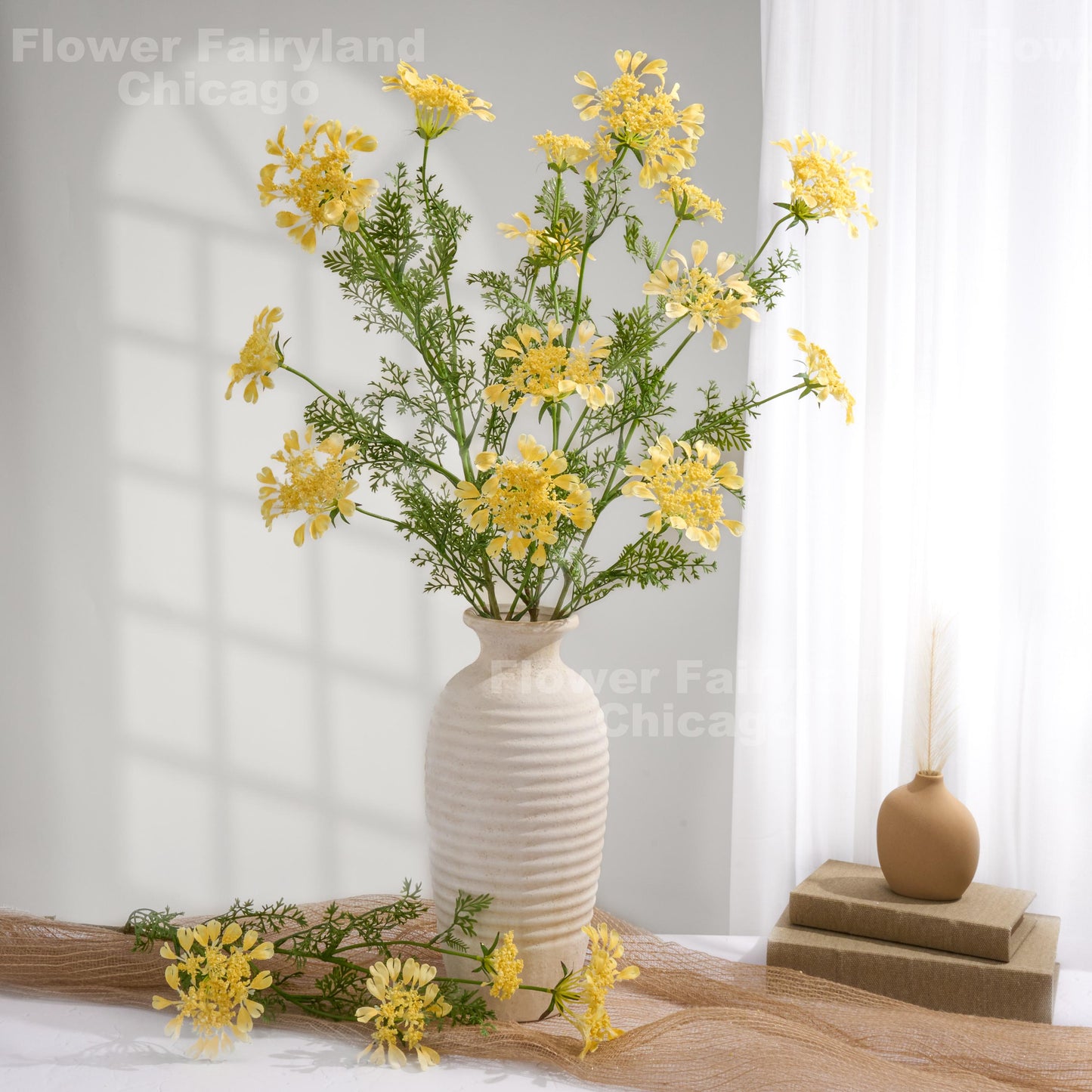 Yellow lace flowers styled in vase
